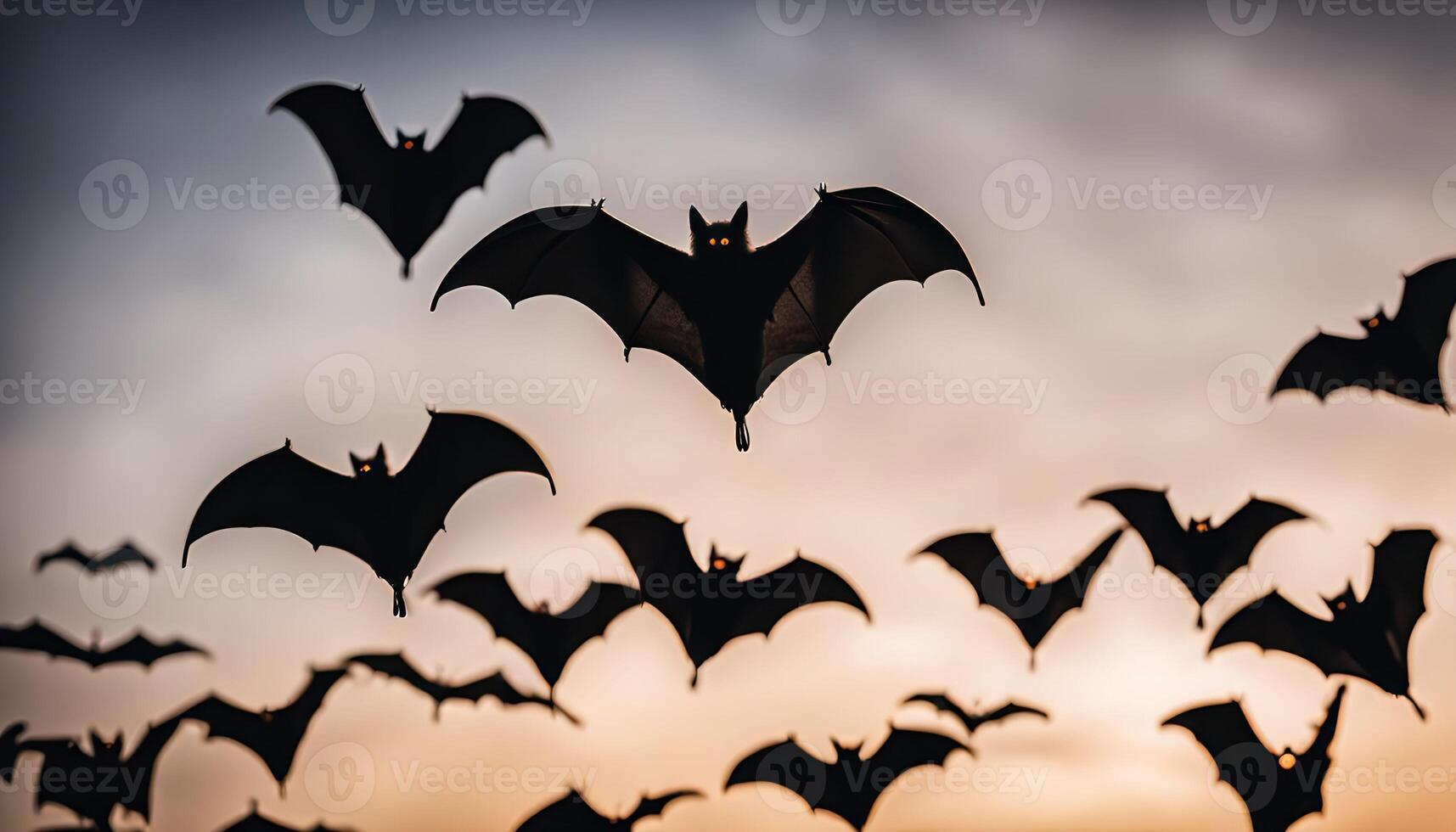 Bats in Flight Against Twilight Sky photo