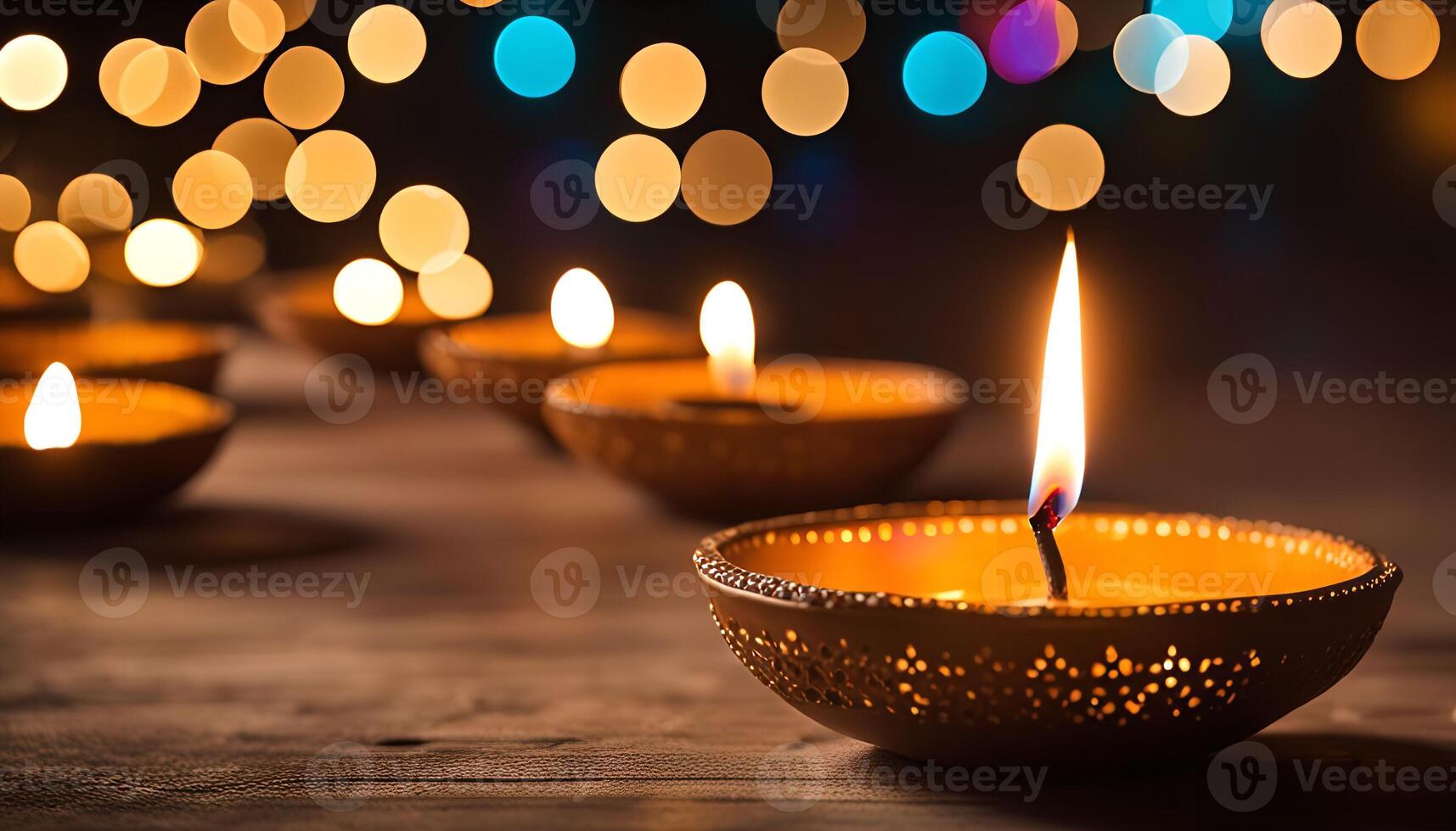 Lit Diya with Bokeh Lights photo