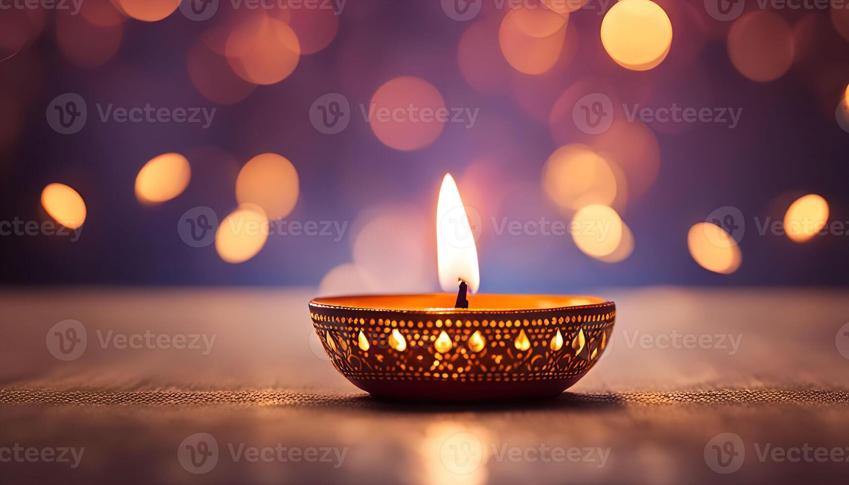Single Lit Diya Against a Bokeh Background photo