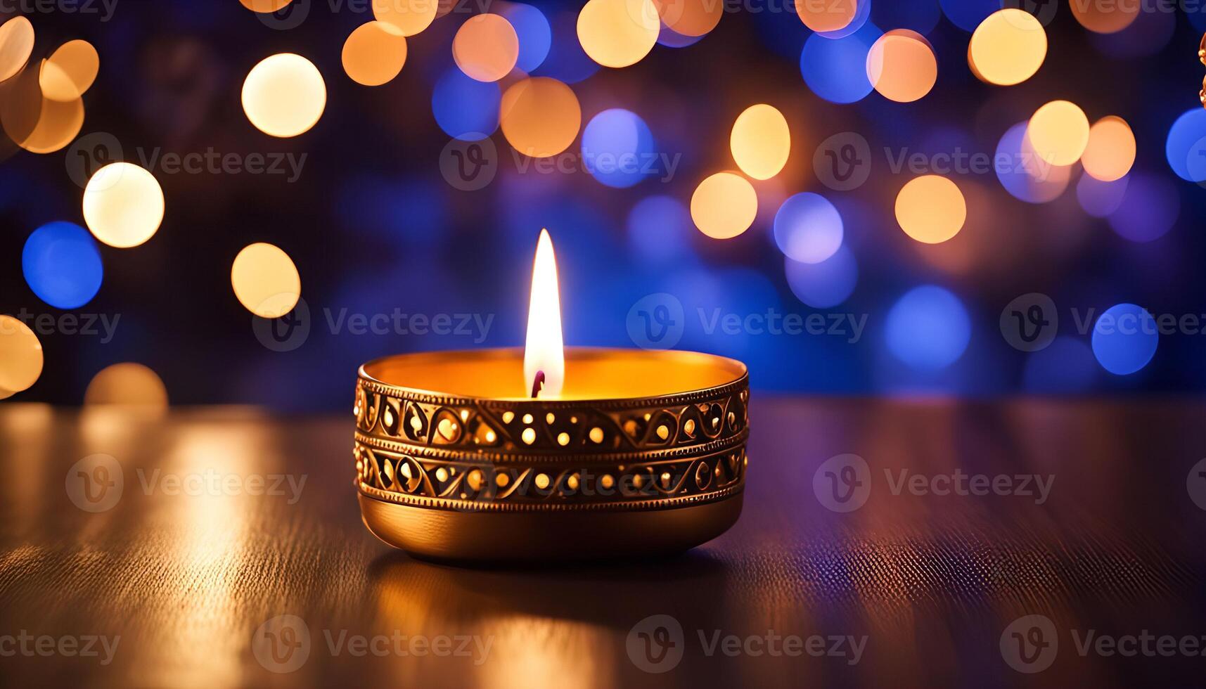 A single candle flame glows in the darkness, offering hope and light. photo