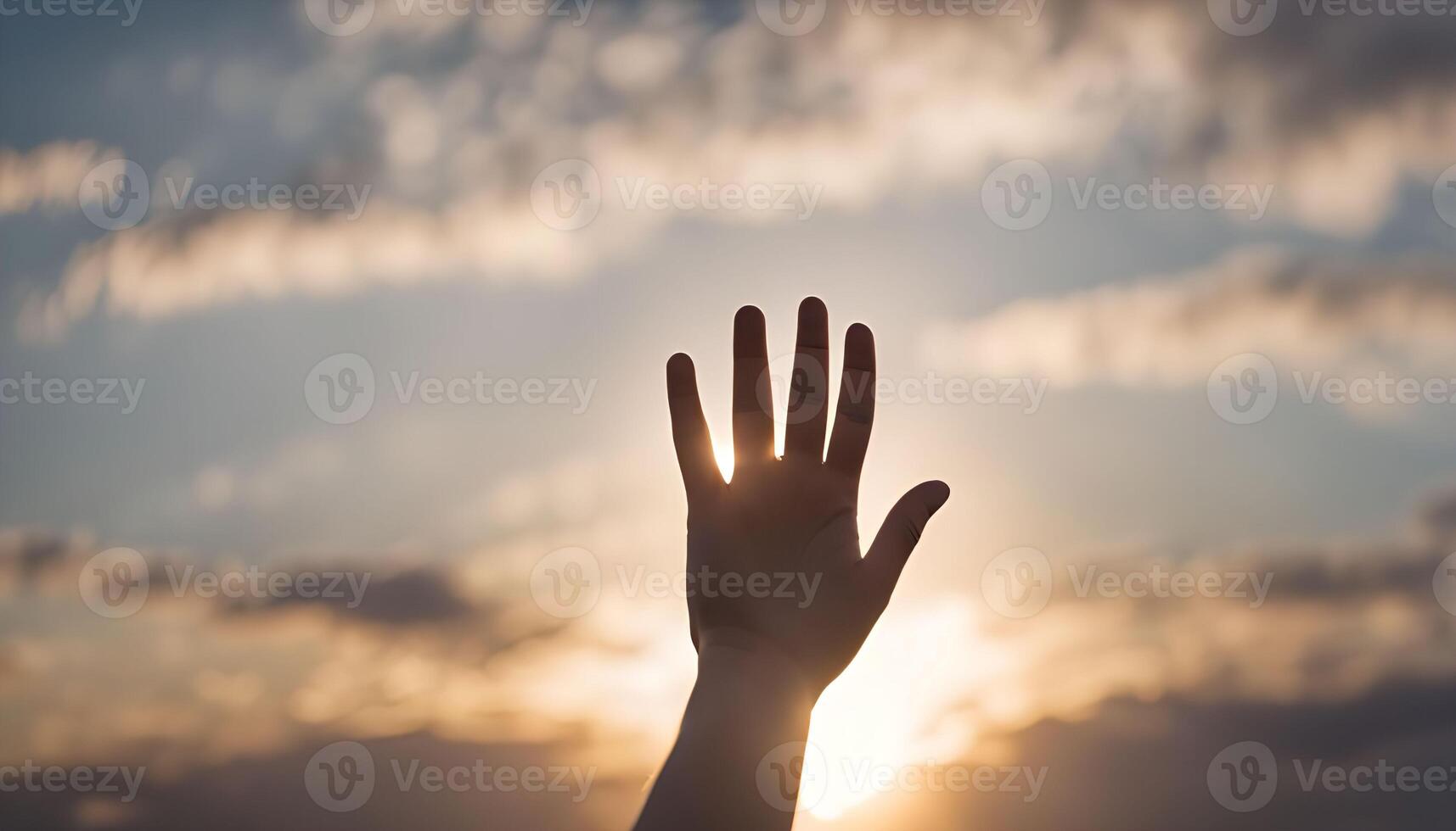 Hand Reaching Towards the Sunset photo