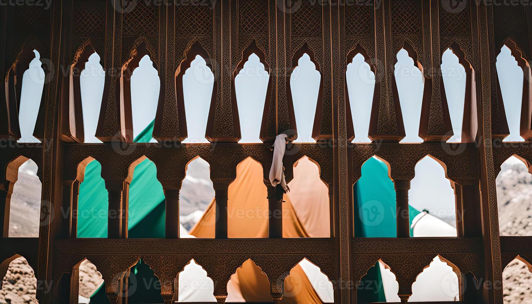 Intricate Latticework Window with a Glimpse of Mountains and Sky photo