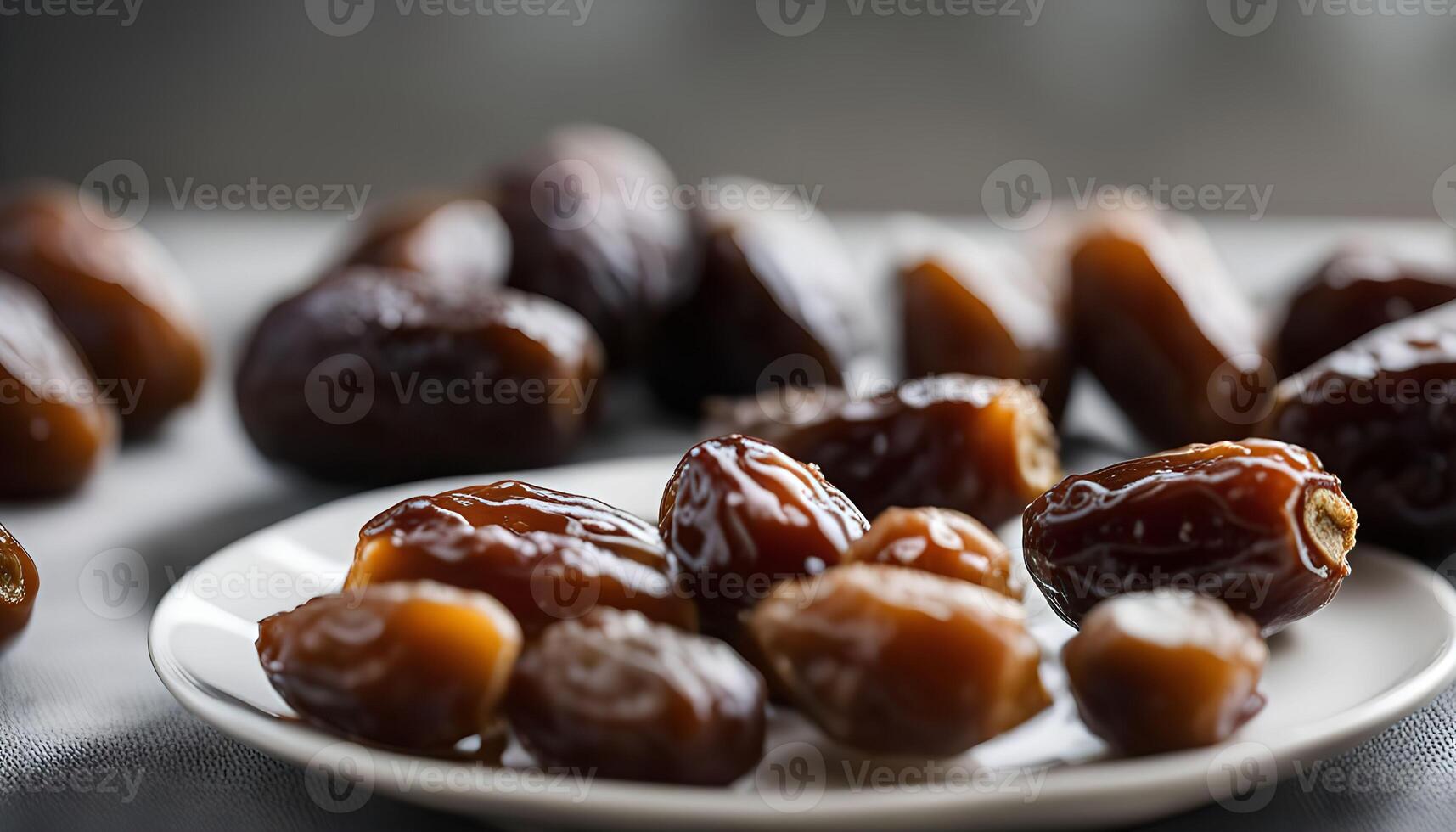 Close-up of Dates on a White Plate photo