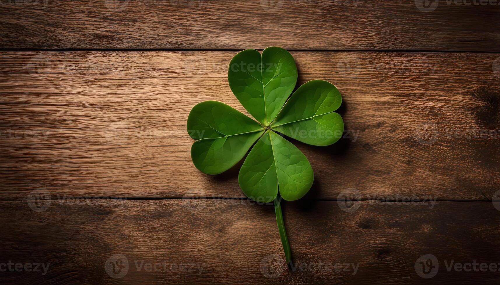 Four Leaf Clover on Wood Background photo