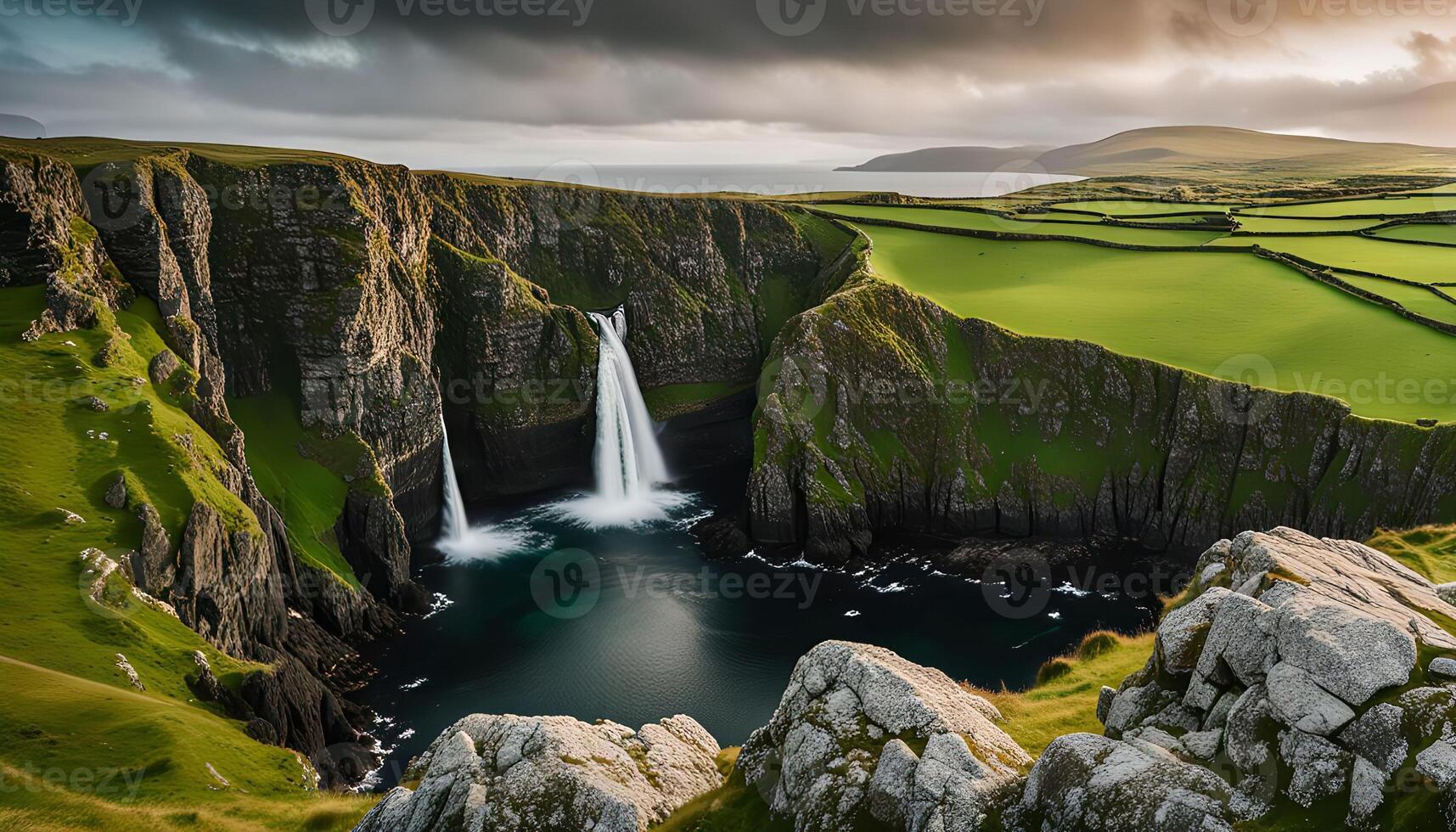 Waterfall cascading into a sea inlet photo