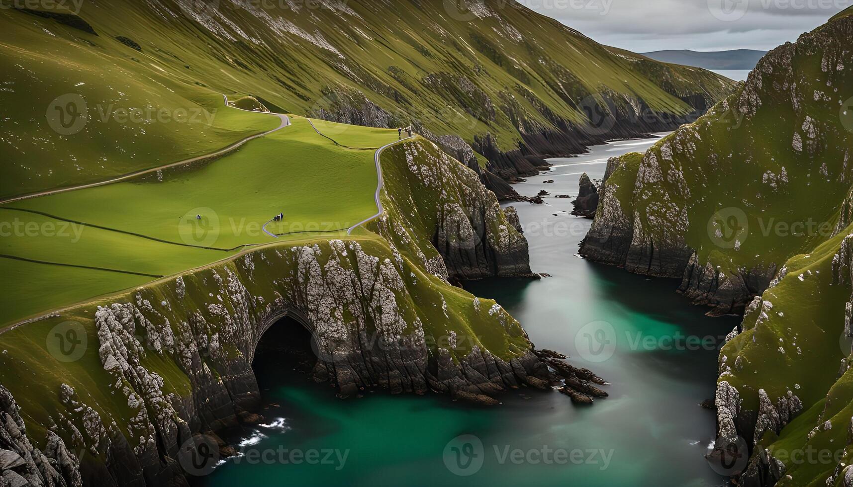 A winding road leads to a dramatic coastal landscape photo