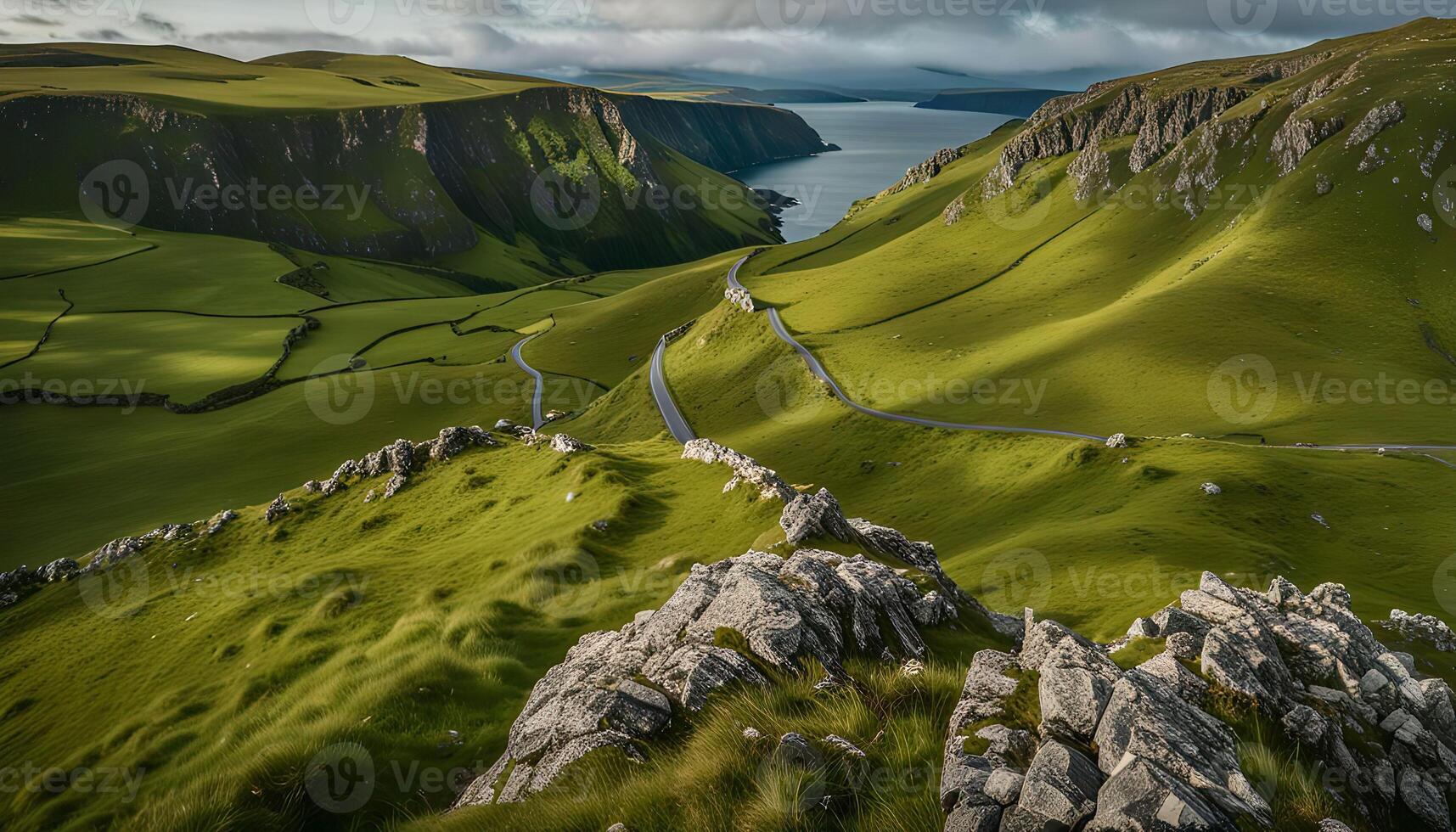 Serene Mountain Landscape with Winding Road and Coastal Inlet photo