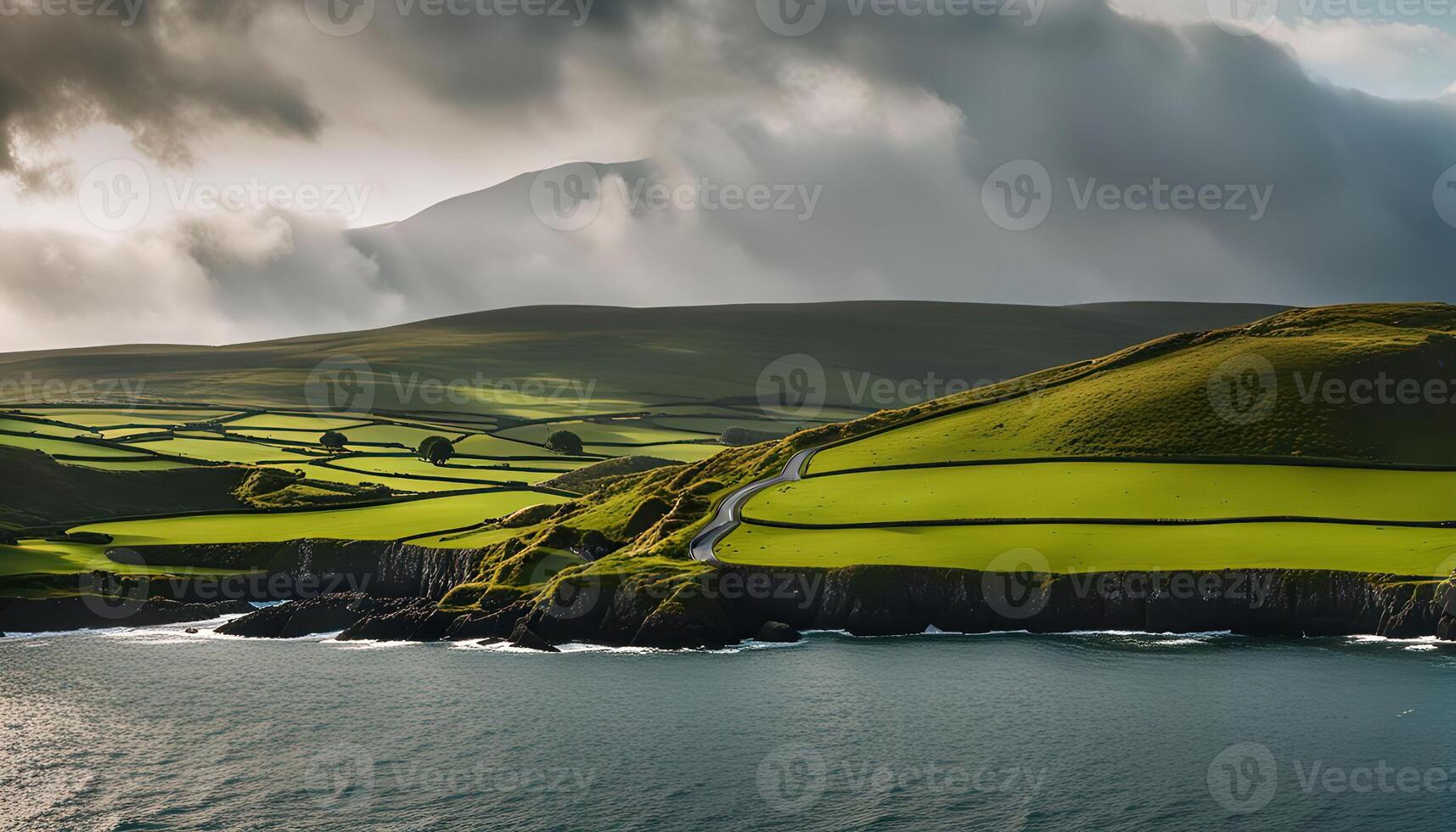 Scenic Coastal Road Winding Through Green Fields photo