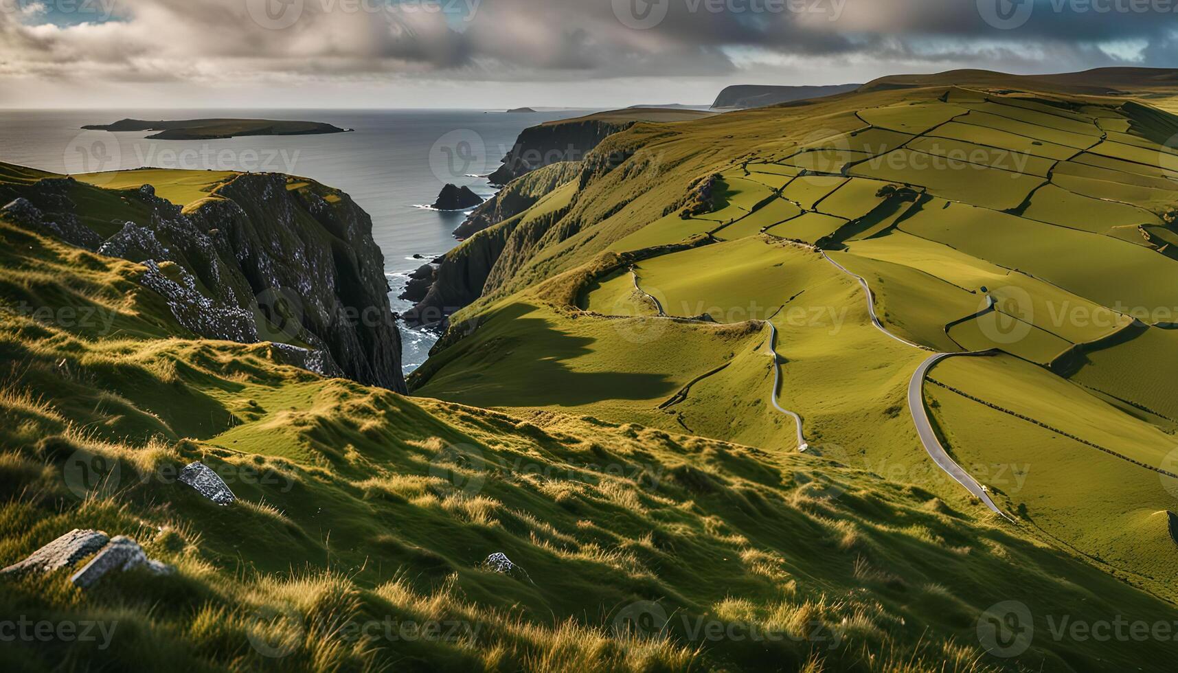 Scenic Coastal Road Winding Through Lush Green Hills photo