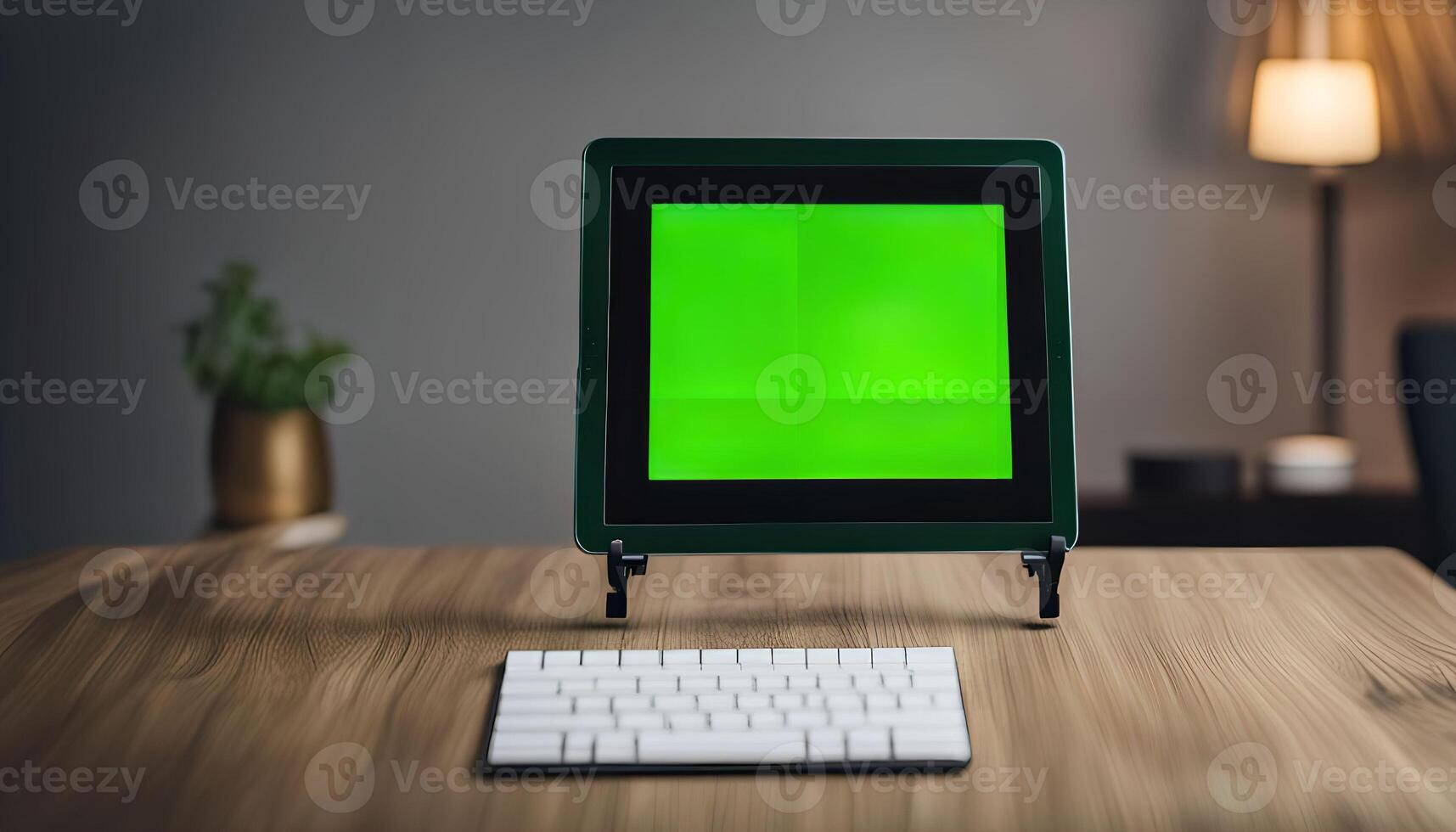 Tablet on a Desk with Green Screen photo