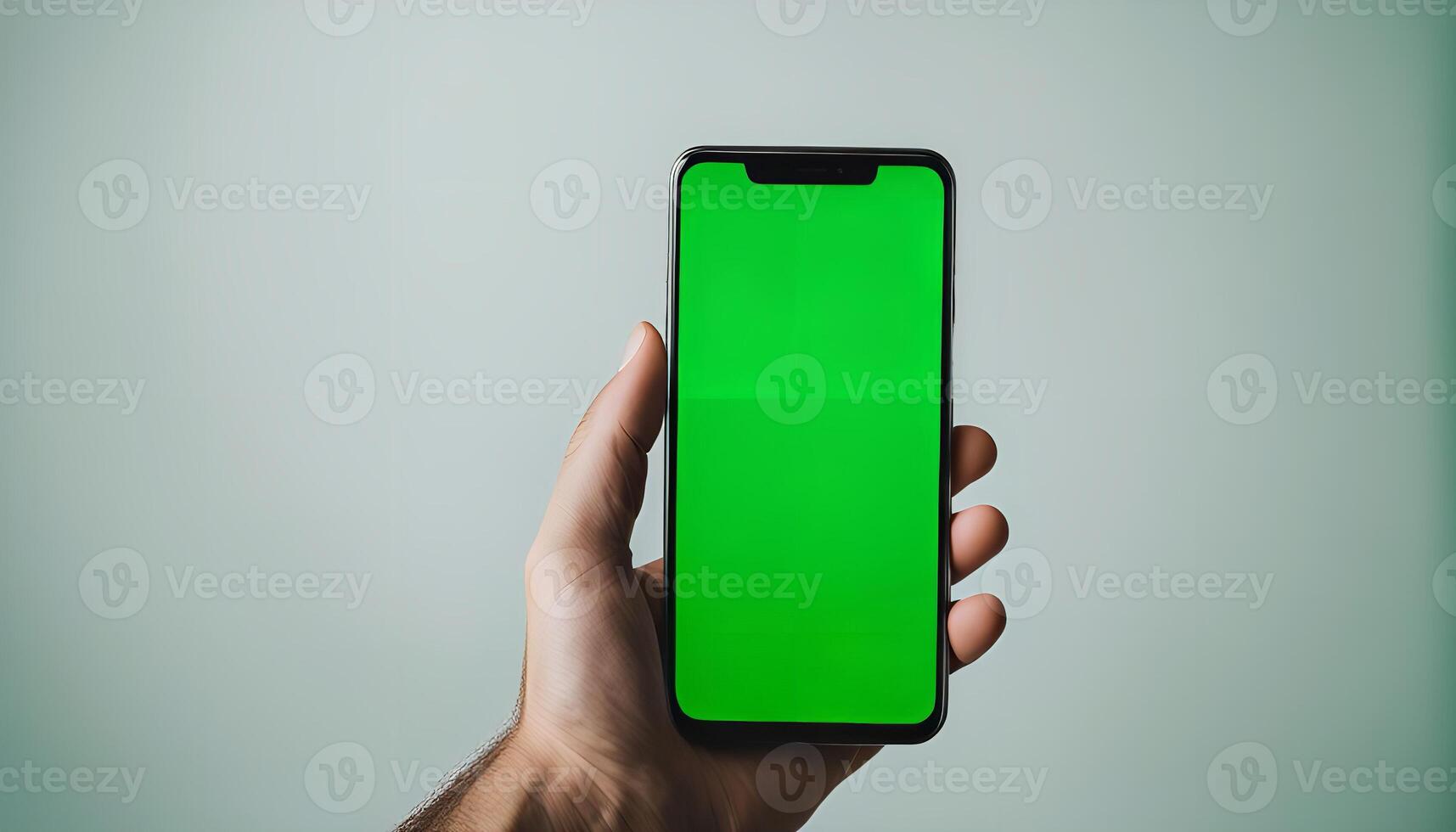 Hand Holding Smartphone with Green Screen photo