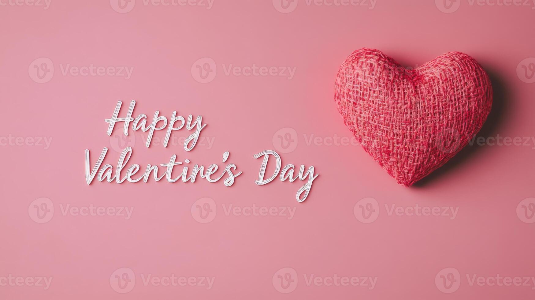 A textured heart crafted from fabric rests on a soft pink surface. Next to it, a heartfelt greeting conveys warm wishes for Valentine's Day, celebrating love and affection. photo