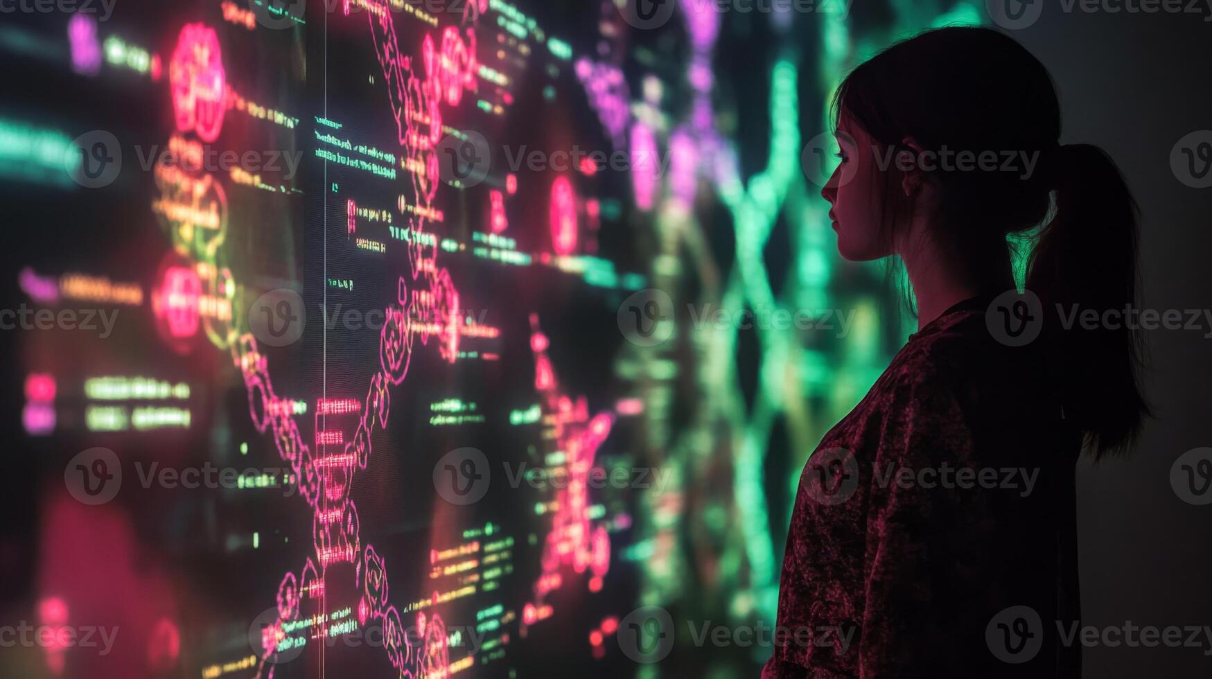 A person engages with a vibrant digital display showcasing bioinformatics data, including DNA structures and various algorithms. photo