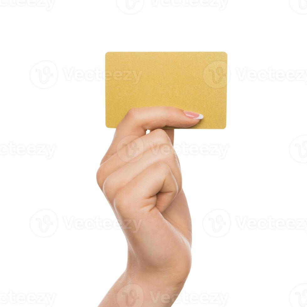 Yellow card. Female hand with french manicure holding plastic credit, woman keeping blank business card on white isolated studio background, copy space, cutout photo