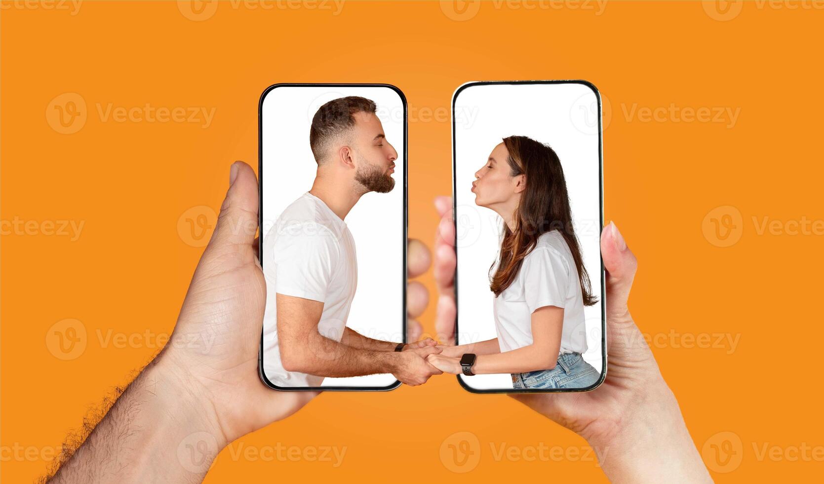 Two hands hold smartphones displaying a couple engaged in a loving chat, showcasing their connection through technology. The vibrant background emphasizes their interaction. photo