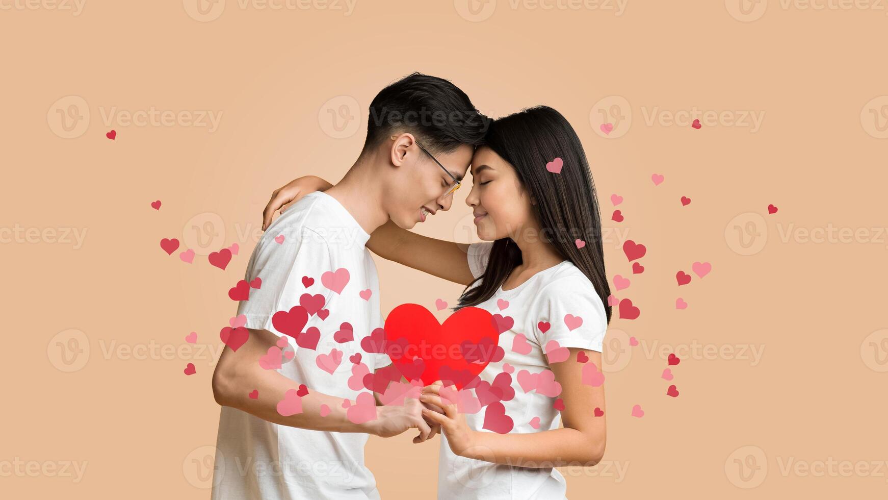 Asian young couple shares a tender kiss, demonstrating their affection and bonding. photo