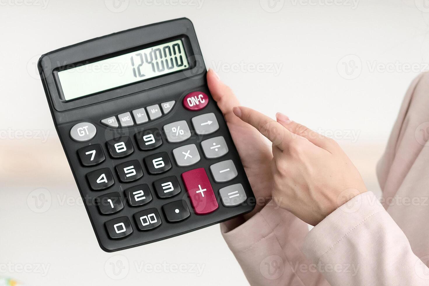 Travel Agency Service. Female Agent Showing Calculator With Price Of Family Tour Consulting African American Tourists Couple In Modern Office, Wearing Face Mask. Selective Focus, Cropped photo