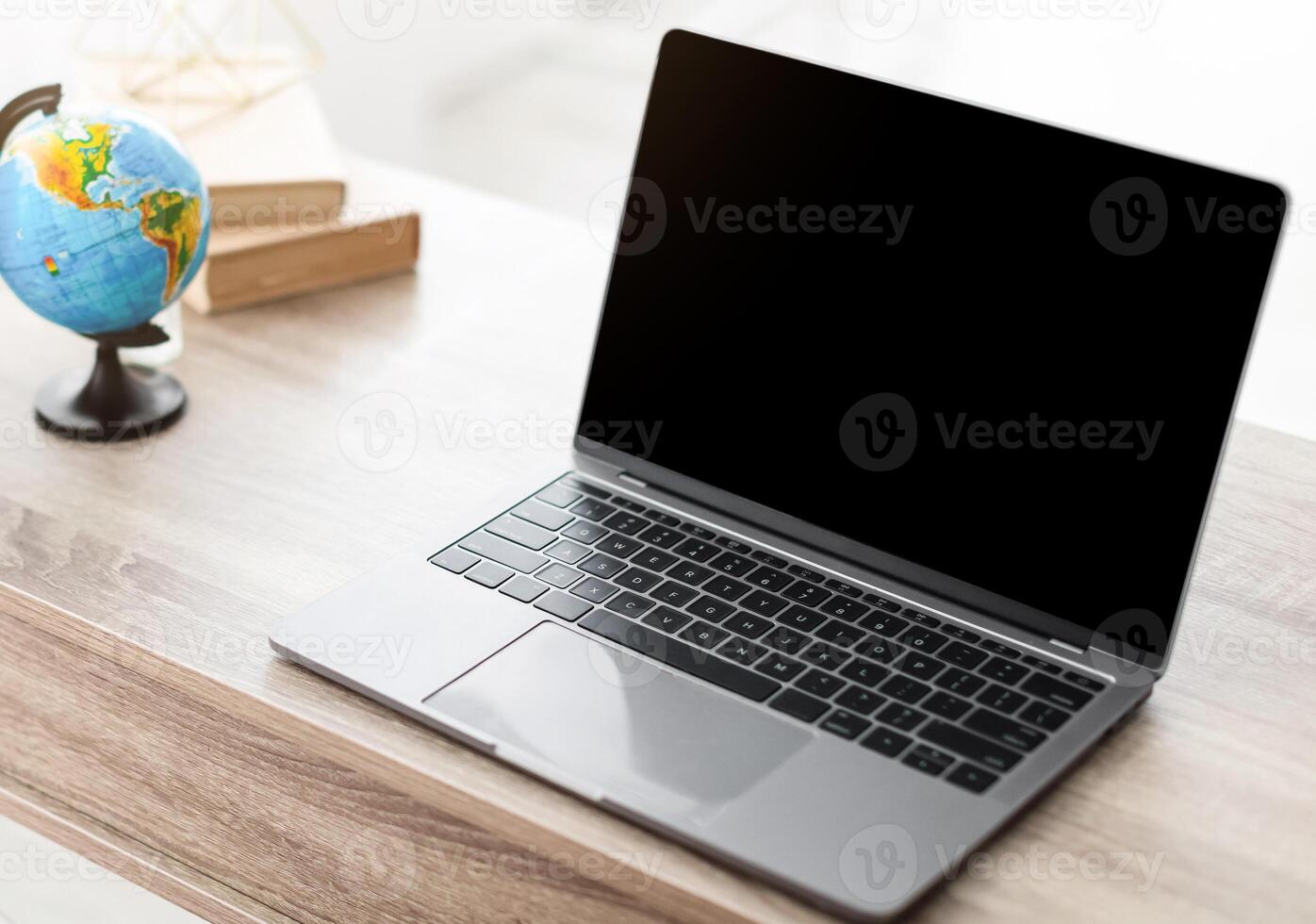 Unrecognizable Female Travel Agent Using Laptop With Empty Screen Making Call Sitting At Desk In Tour Agency Office. Online Consultation, E-Teaching. Selective Focus, Mockup photo