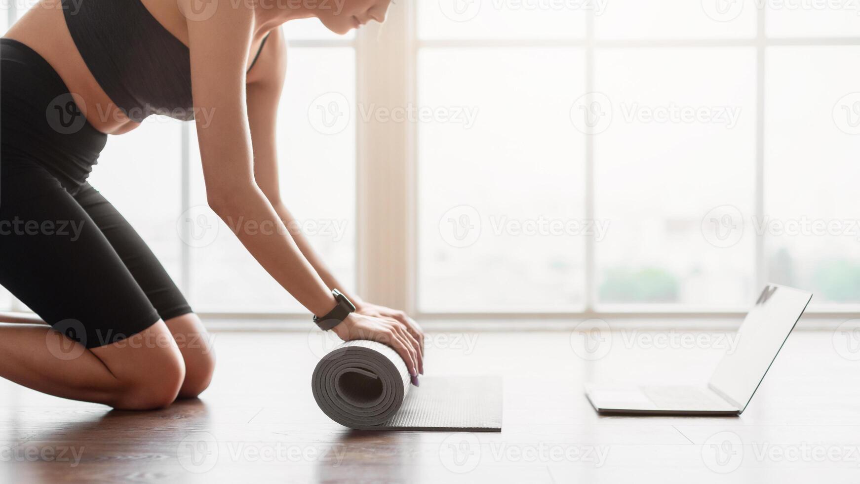 Healthy Lifestyle Concept. Close Up Profile Sive View Of Unrecognizable Lady Wearing Smartwatch Rolling Yoga Mat Practicing Pilates Using Pc, Ready For Morning Routine Training. Wellness And Wellbeing photo