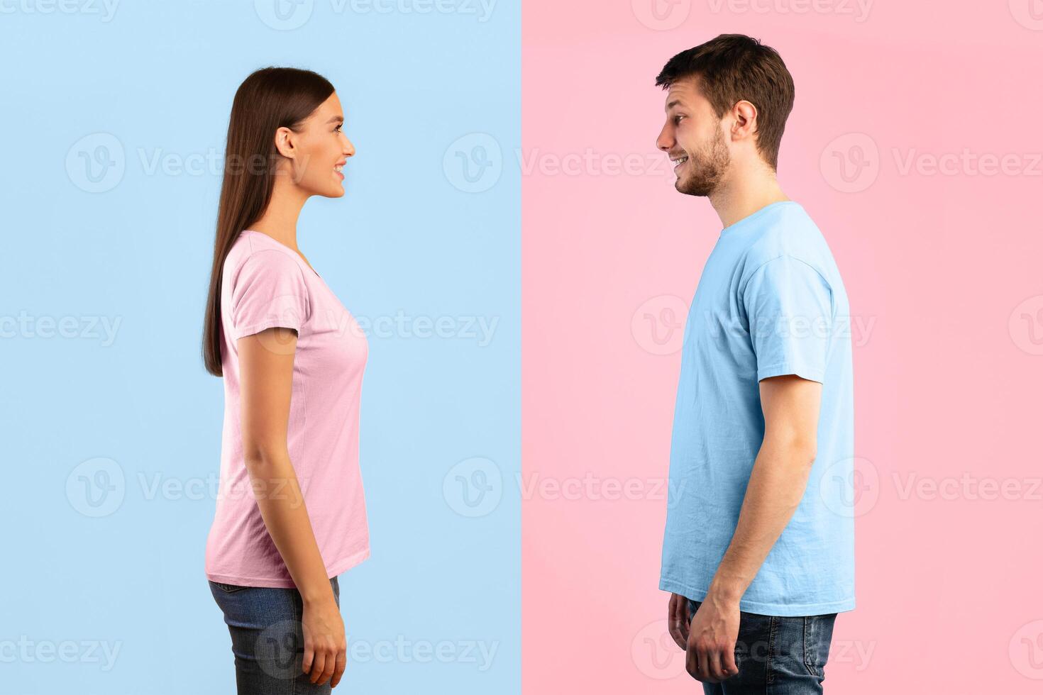 Profile portrait of casual woman and bearded smiling caucasian man posing isolated over blue and yellow studio background. Side view of positive couple standing and looking at each other photo