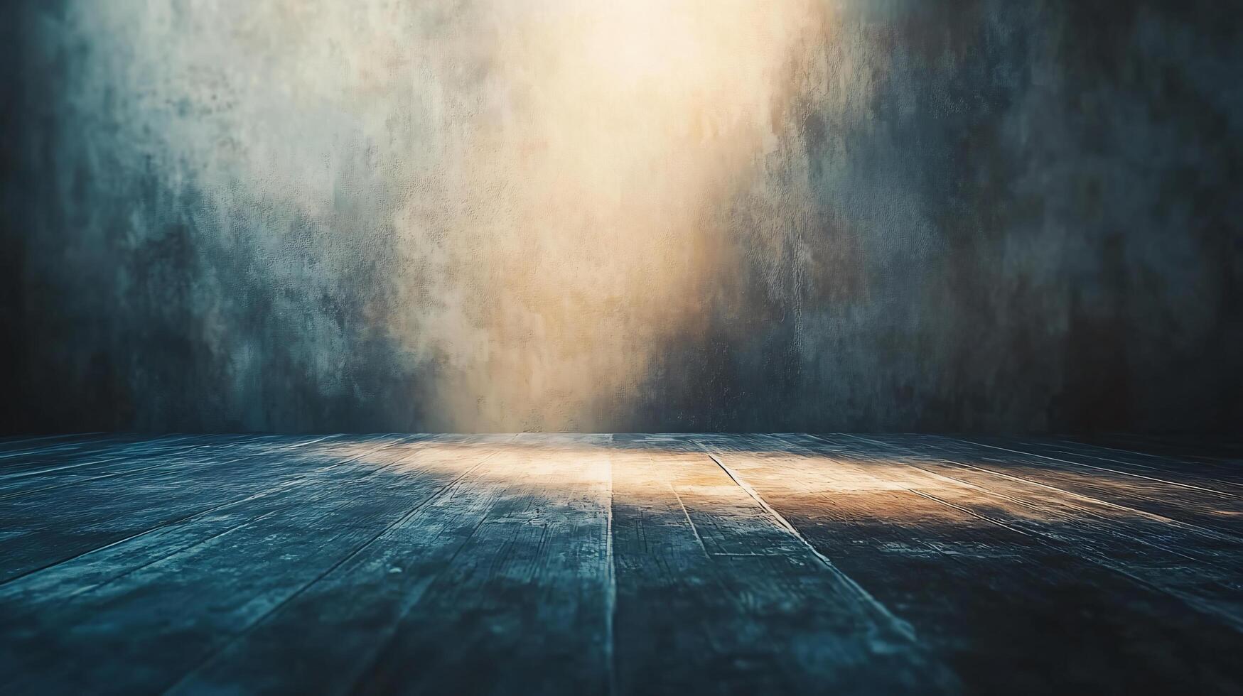 A large empty room with a wooden floor and a wall photo