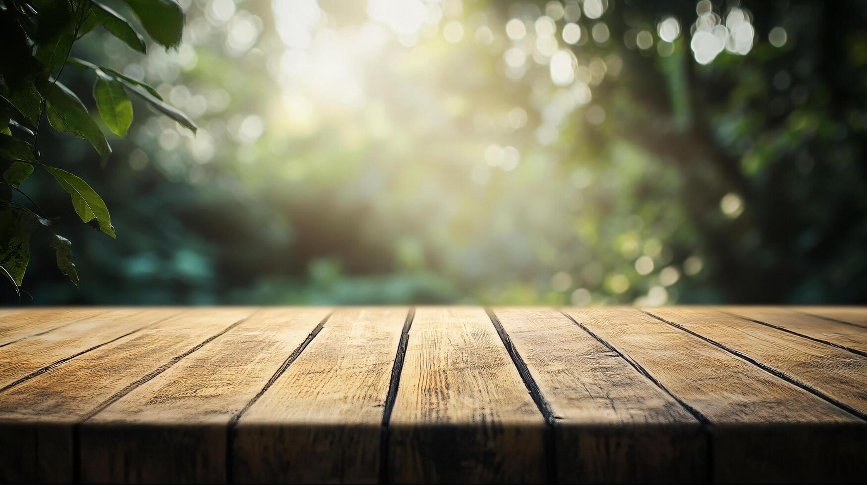 A wooden table with a view of trees and a bright sun photo