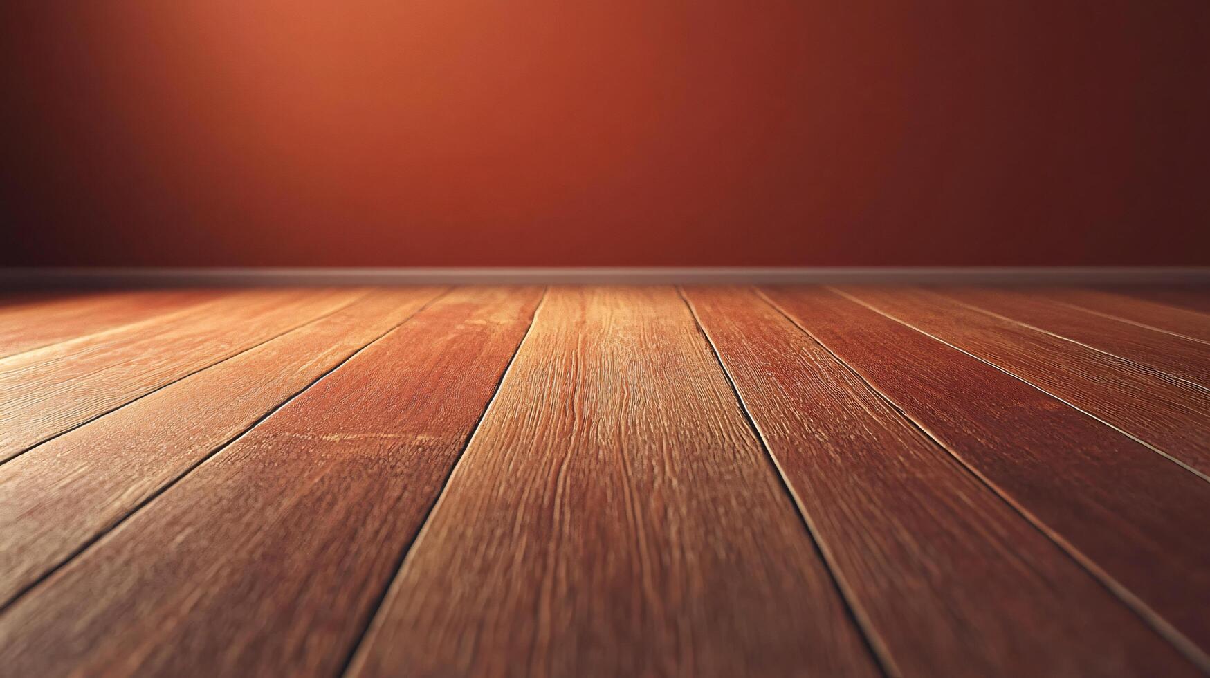A wooden floor with a red wall in the background photo