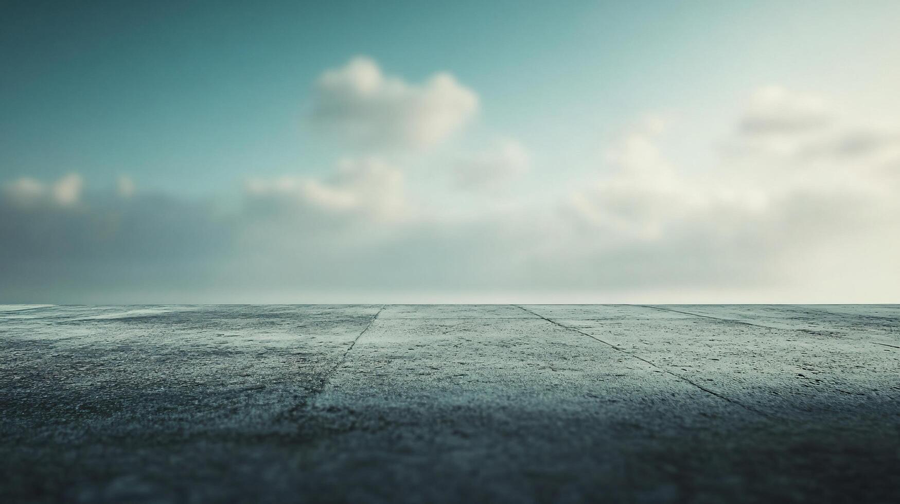 A cloudy sky with a large body of water in the background photo