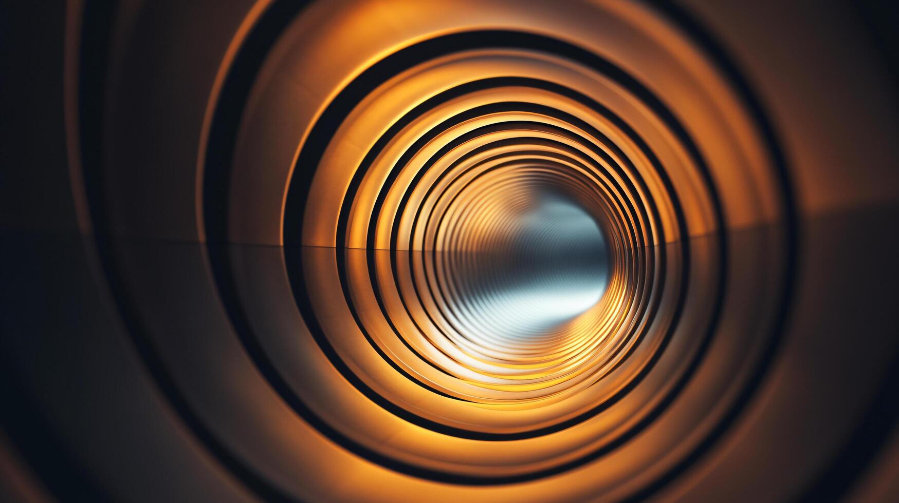 A large, curved tunnel with a bright orange light shining through it photo