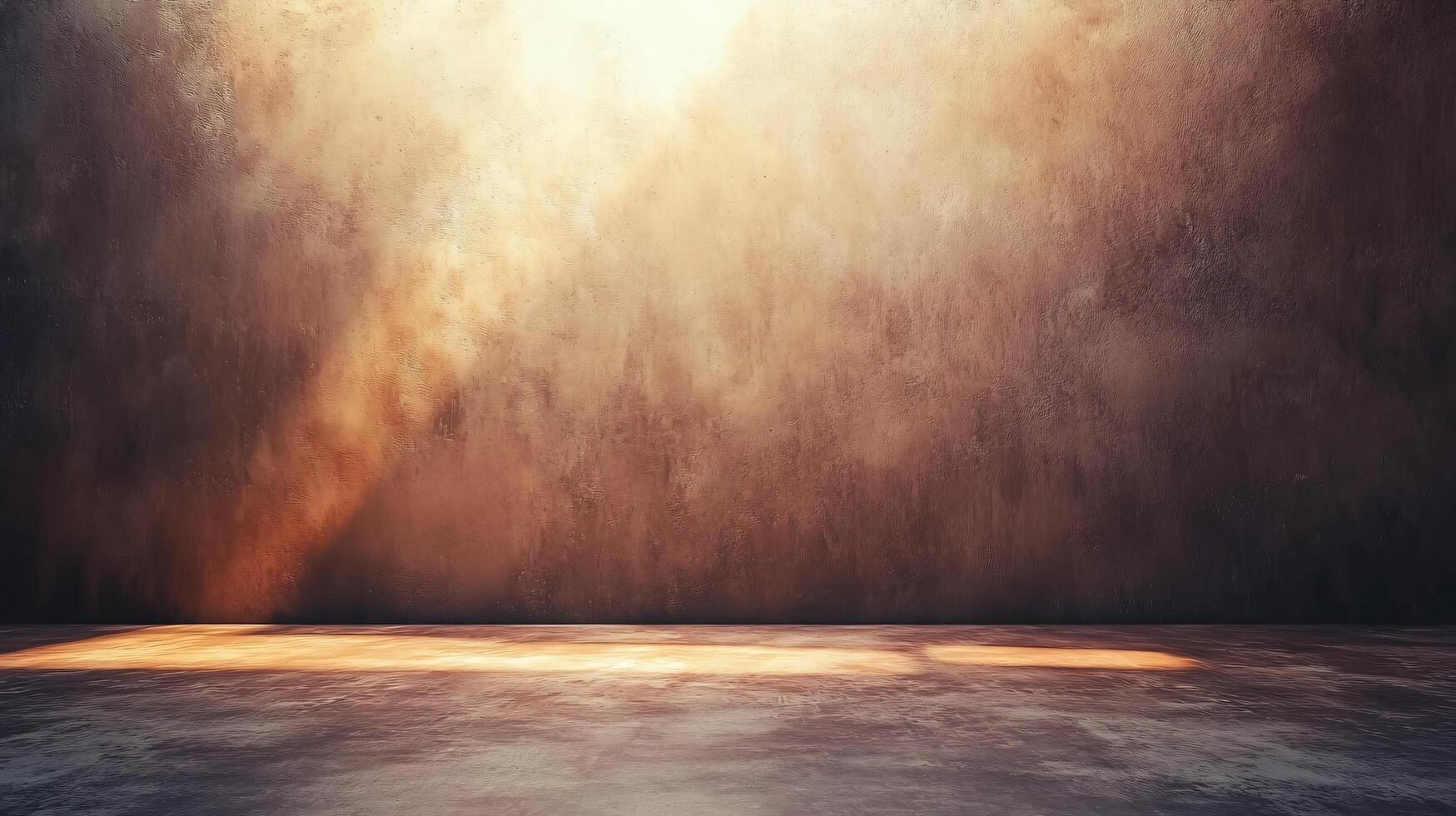 A large, empty room with a wall that is covered in dust and dirt photo