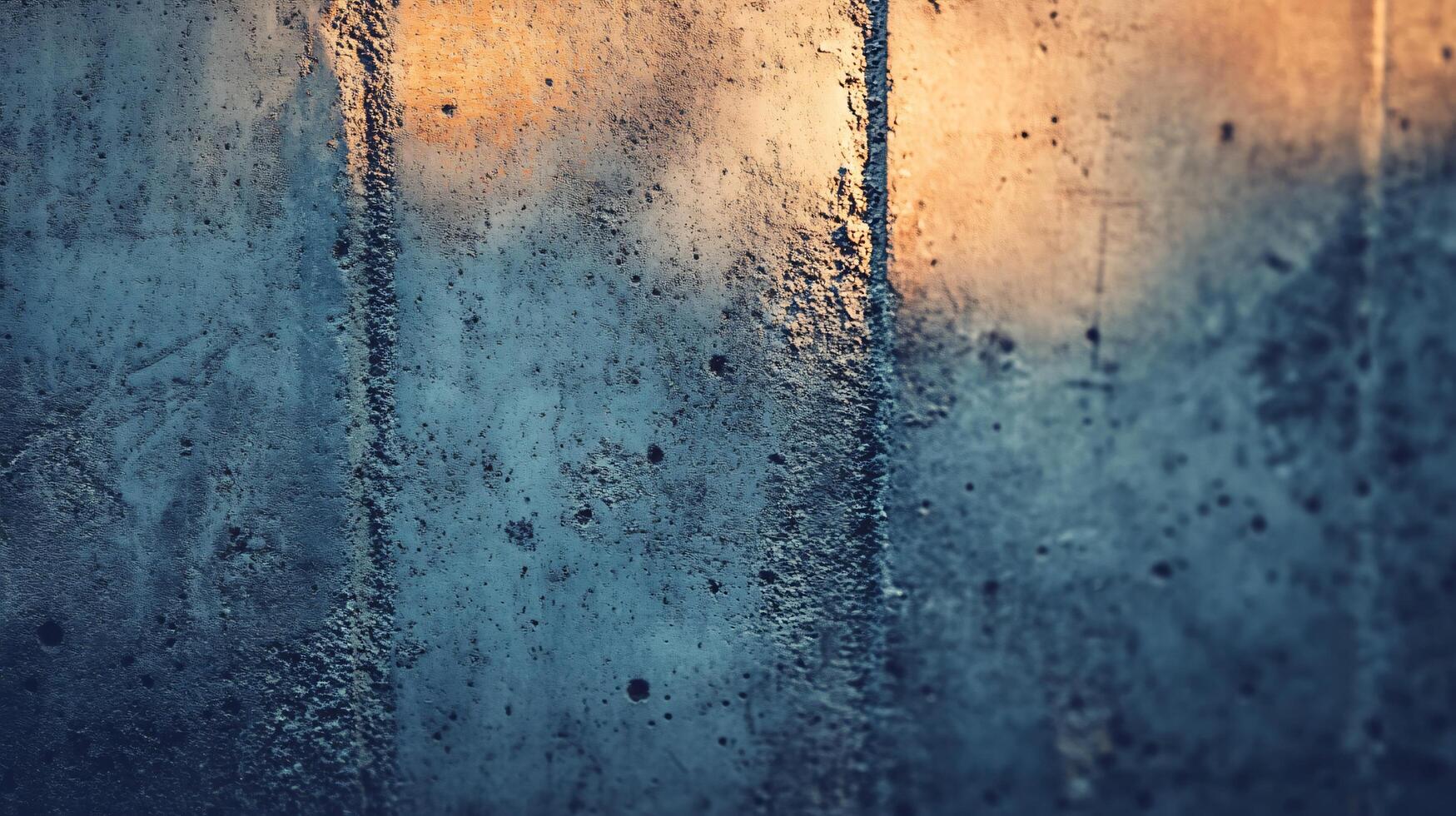 A blurry image of a window with a blue background and a white frame photo