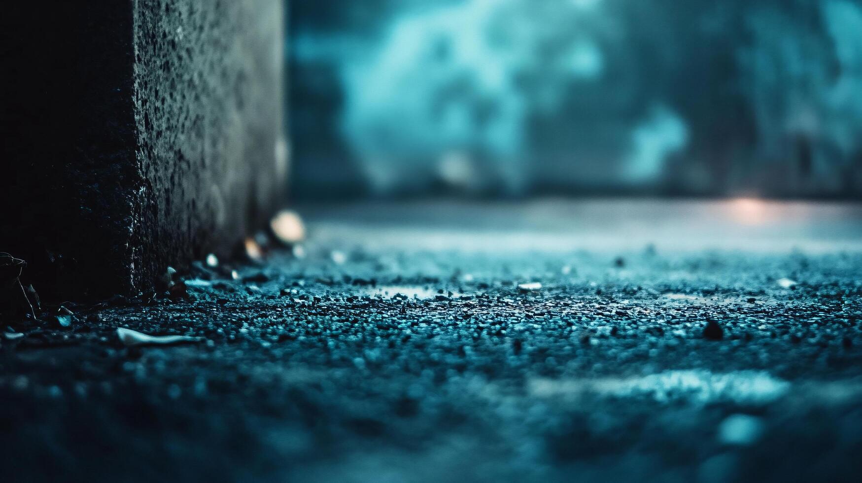 A blurry image of a wet sidewalk with a dark grey background photo