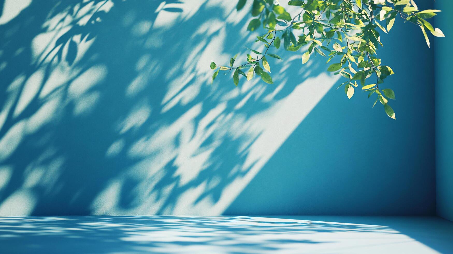 A blue wall with a tree branch casting a shadow on it photo