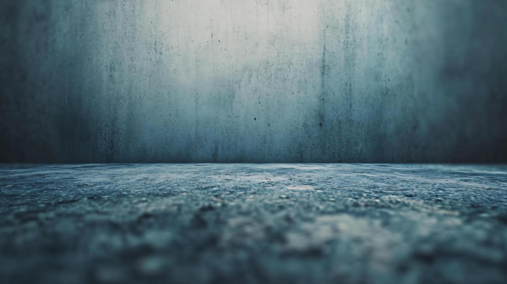 A grey and blue wall with a wet spot on it photo