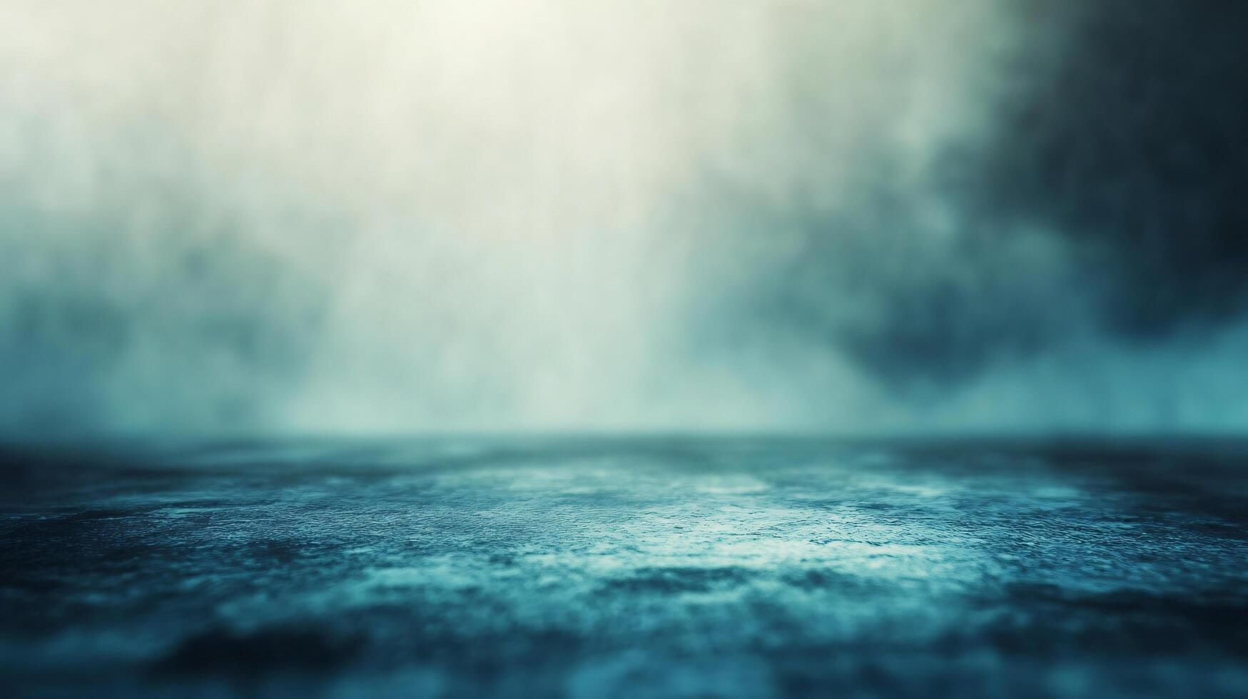 A blurry image of a wet road with a misty sky in the background photo