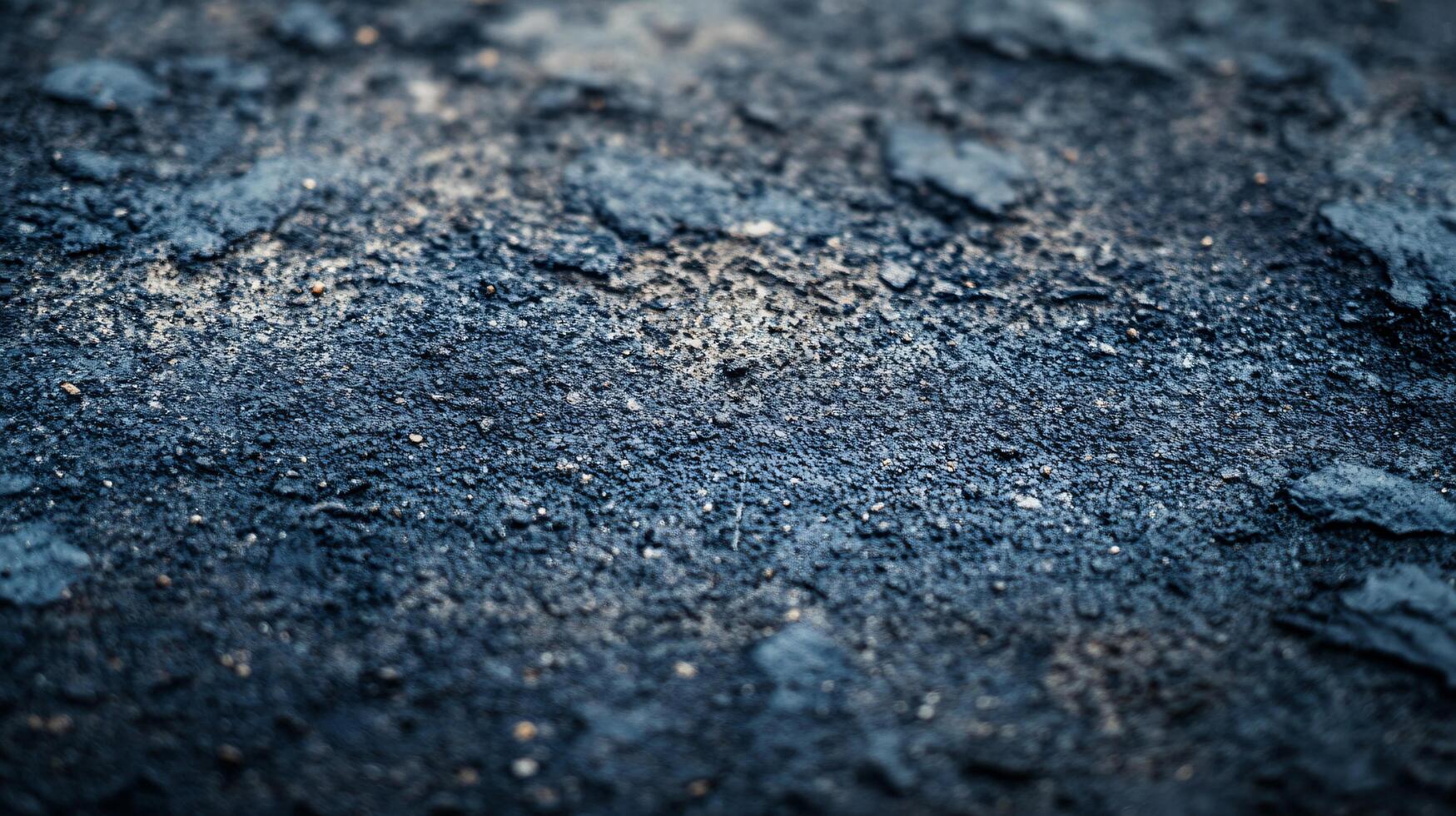 A blue and gray background with a few white specks photo