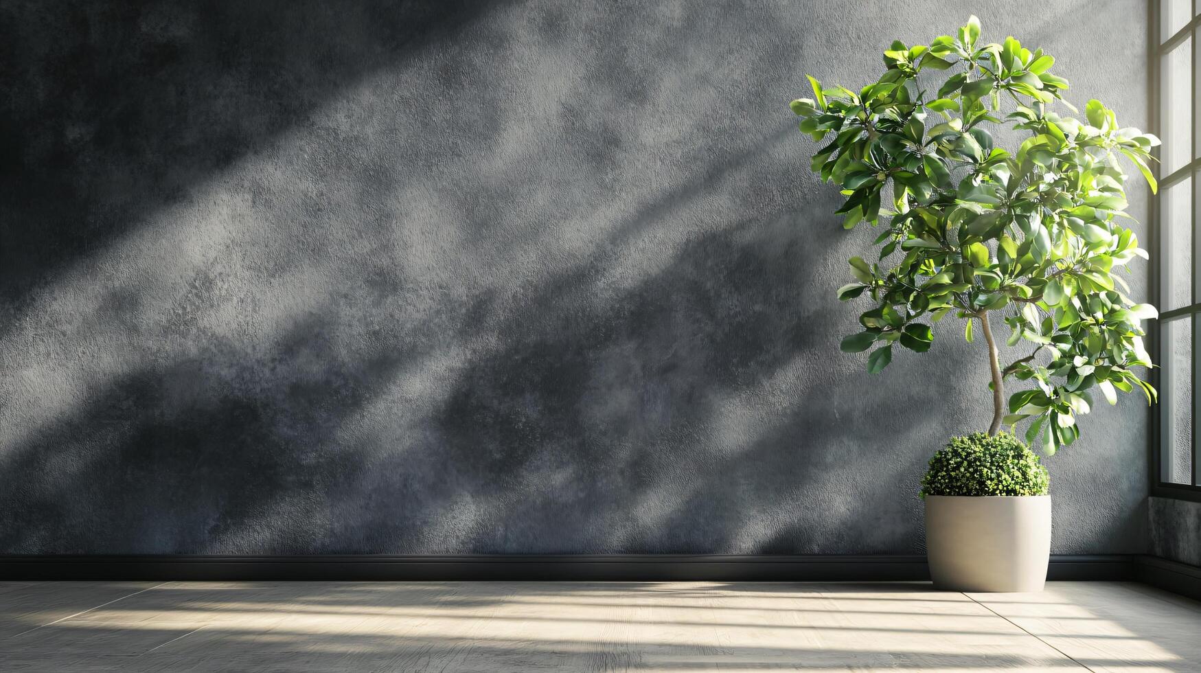 A large potted plant sits in front of a wall with a window photo
