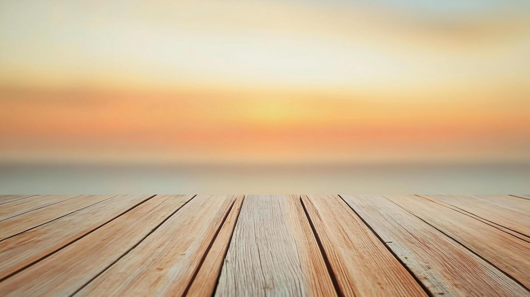 A wooden board with a view of the ocean and a sunset in the background photo