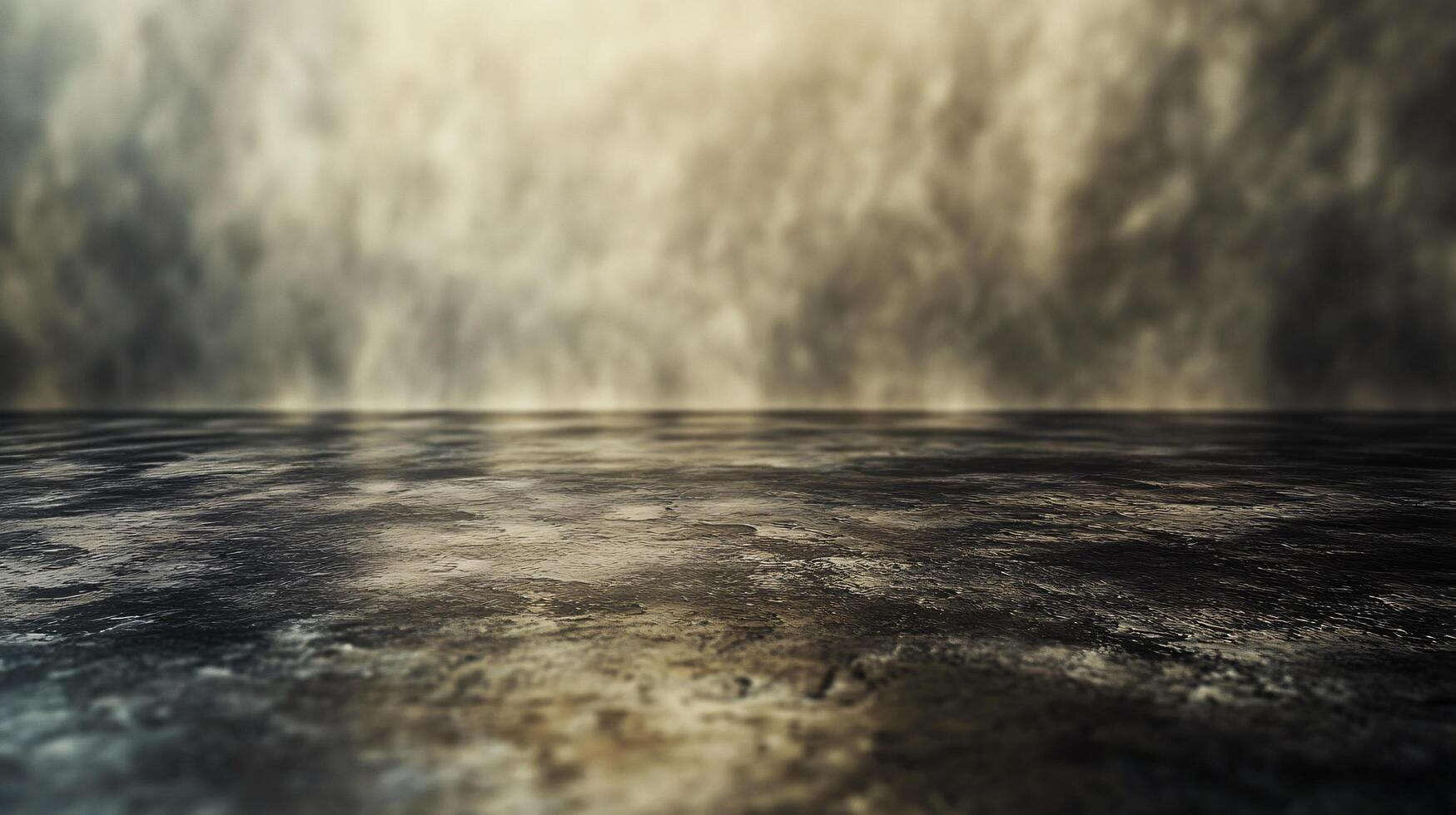 A grey and wet pavement with a blurry background photo