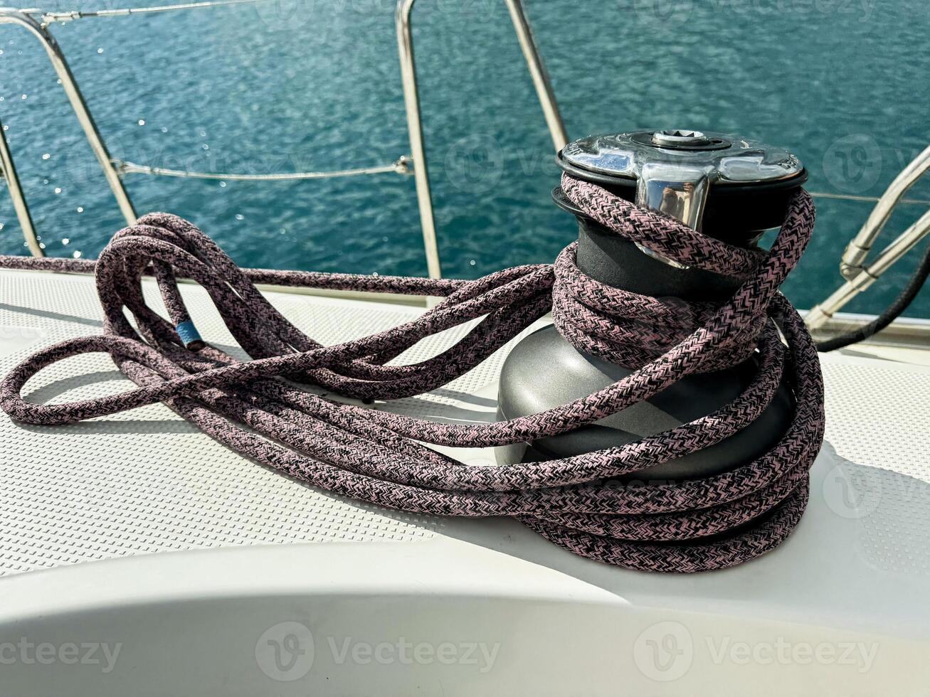 Sailing equipment with mooring rope on a yacht during a clear sunny day photo