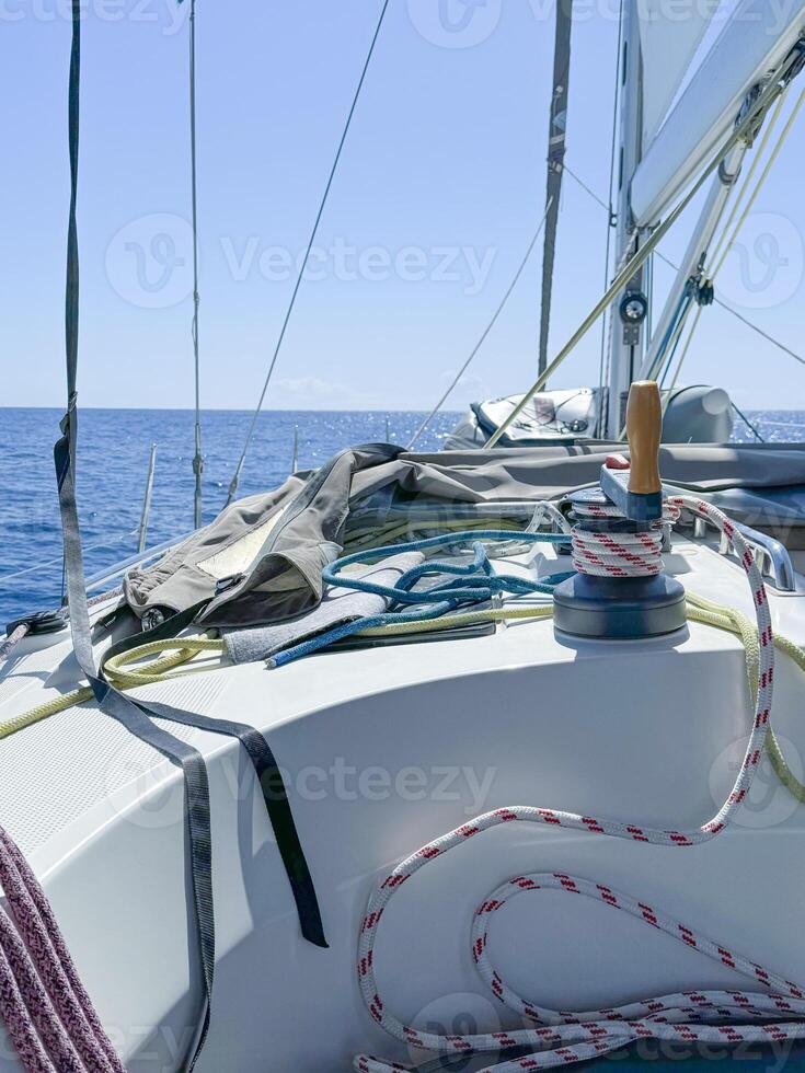 Sailing on a clear day with blue waters and plenty of ropes photo