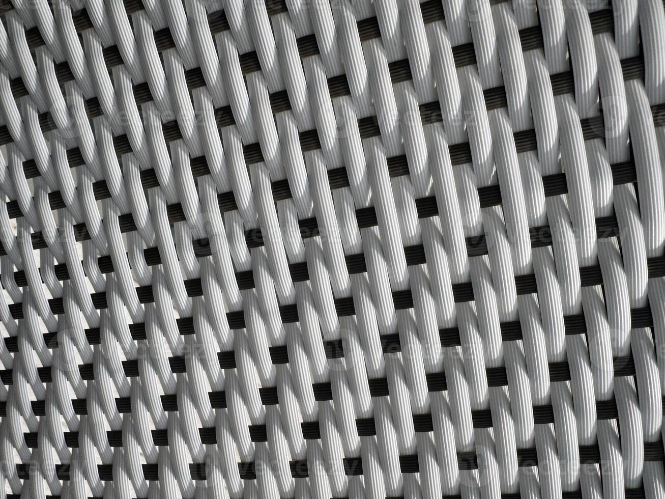 White woven texture displayed closely with a pattern of interlacing strands photo