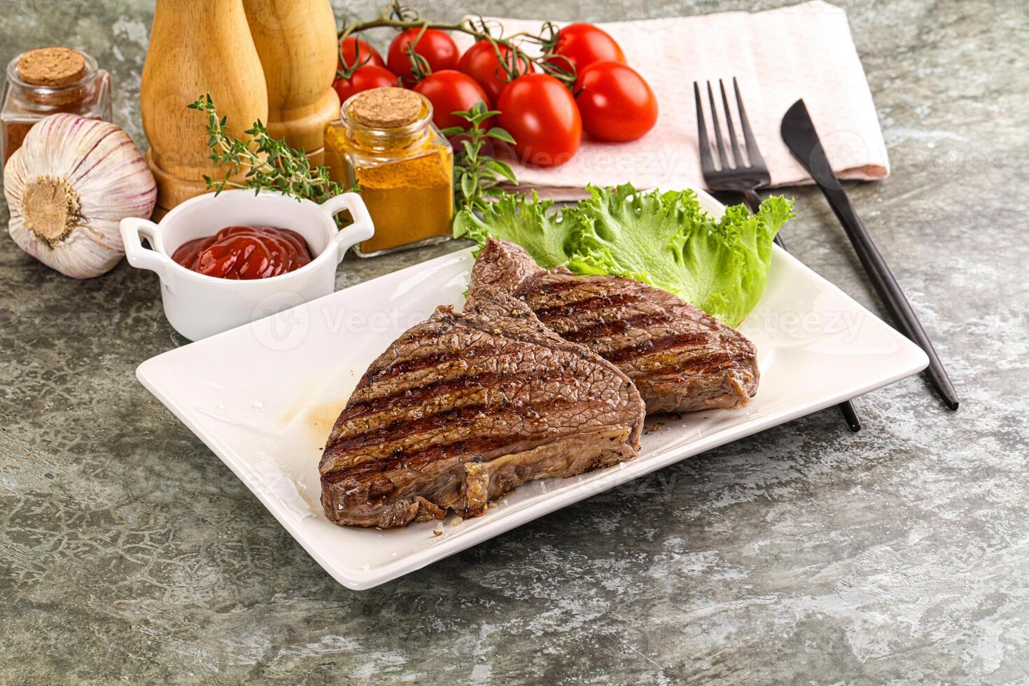 Delicus grilled beef steak with sauce photo
