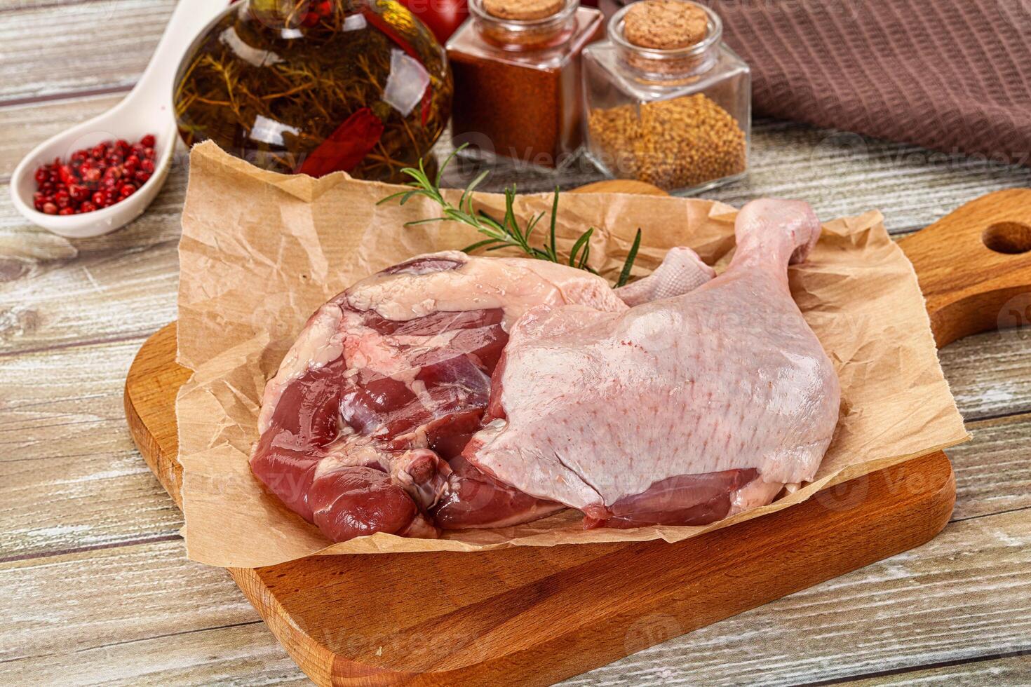 Delicous raw duck leg for cooking photo