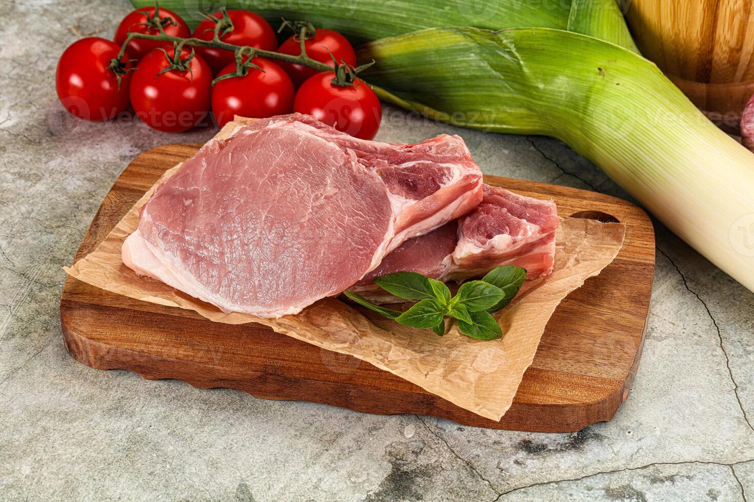 Raw pork steak loin with bone photo