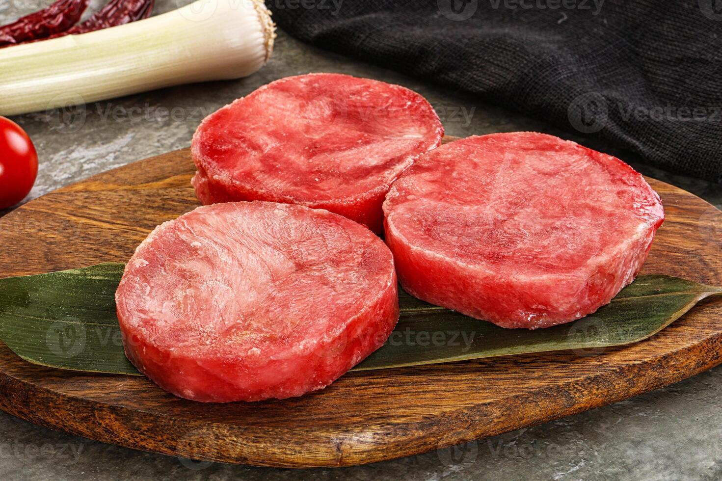 Delicous raw tuna medallion for cooking photo