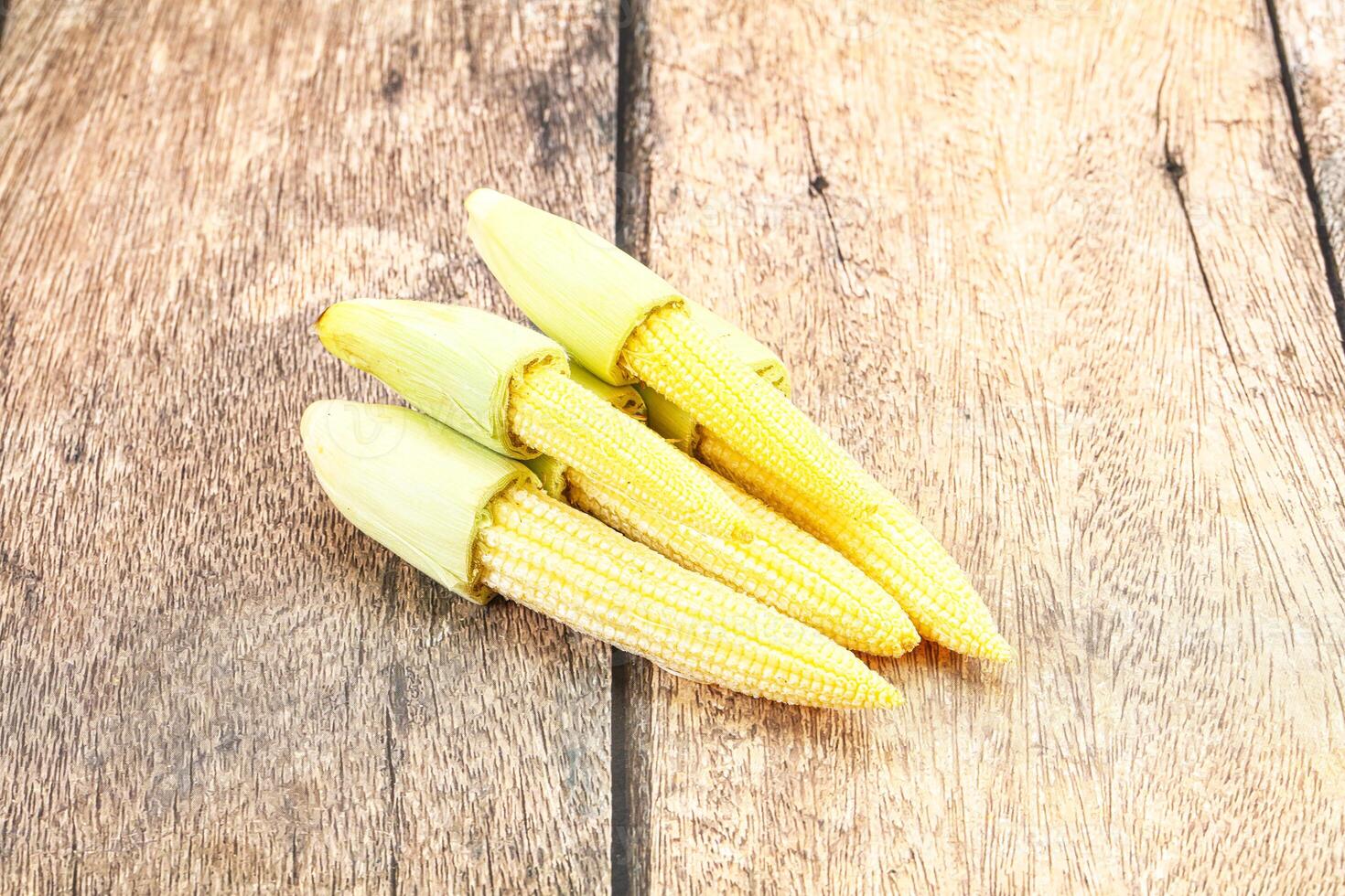 Small young baby corn heap photo