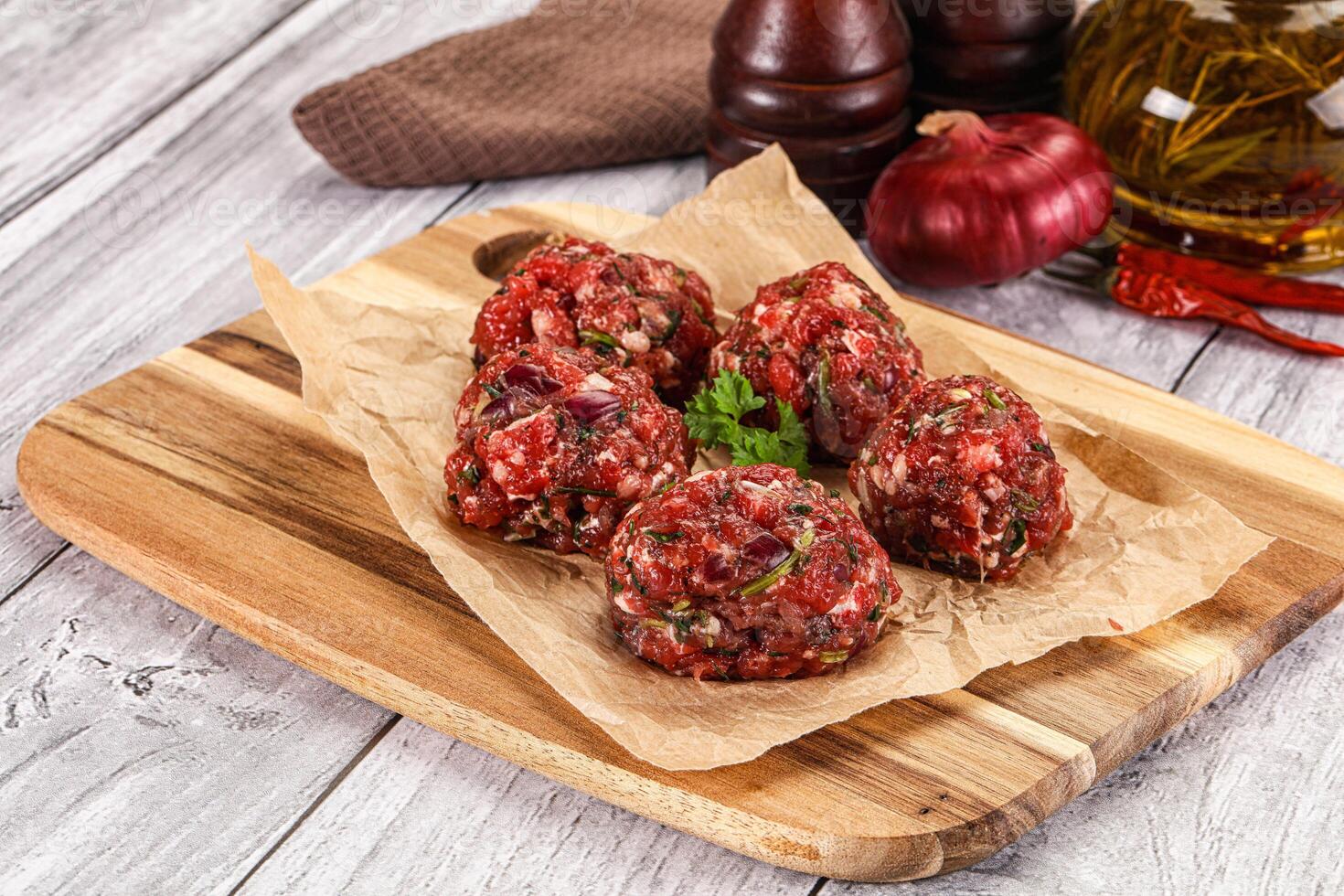 Raw beef meatballs for cooking photo
