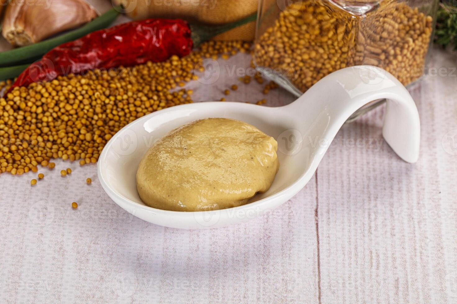 Dijon mustard sauce in the bowl photo