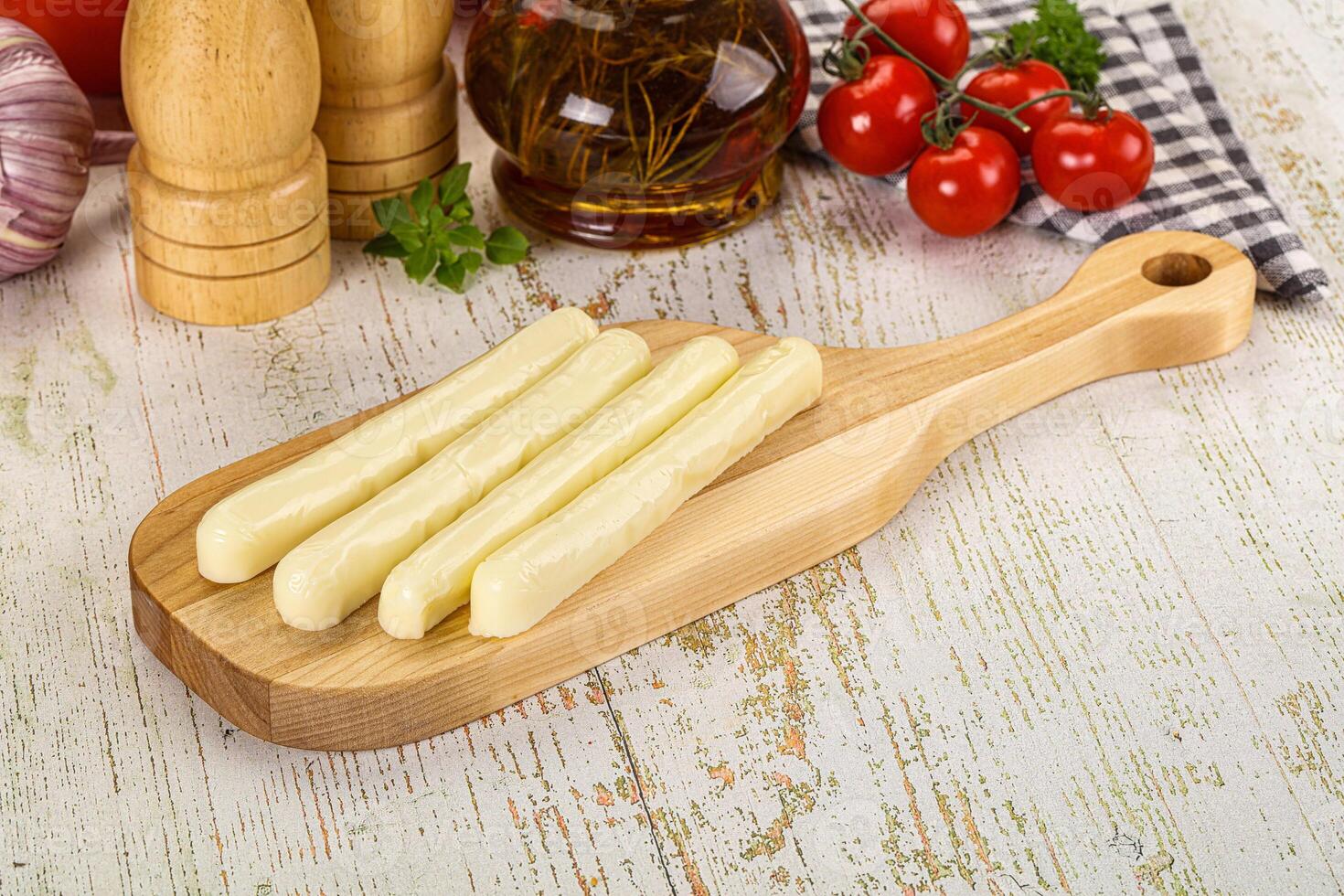 White mozzarella sticks over board photo